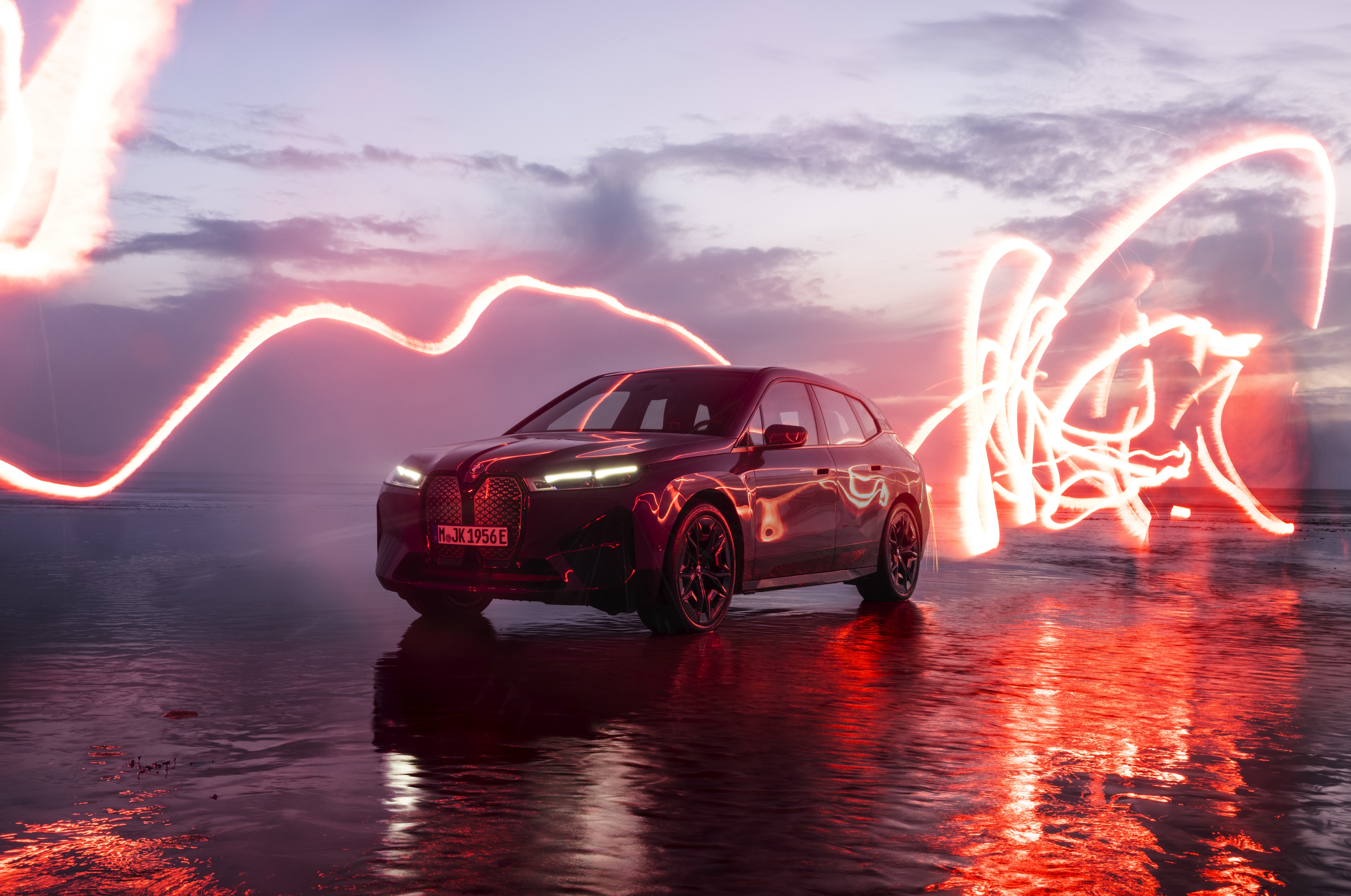 BMW iX M60 electric SUV with light trails HD Wallpaper