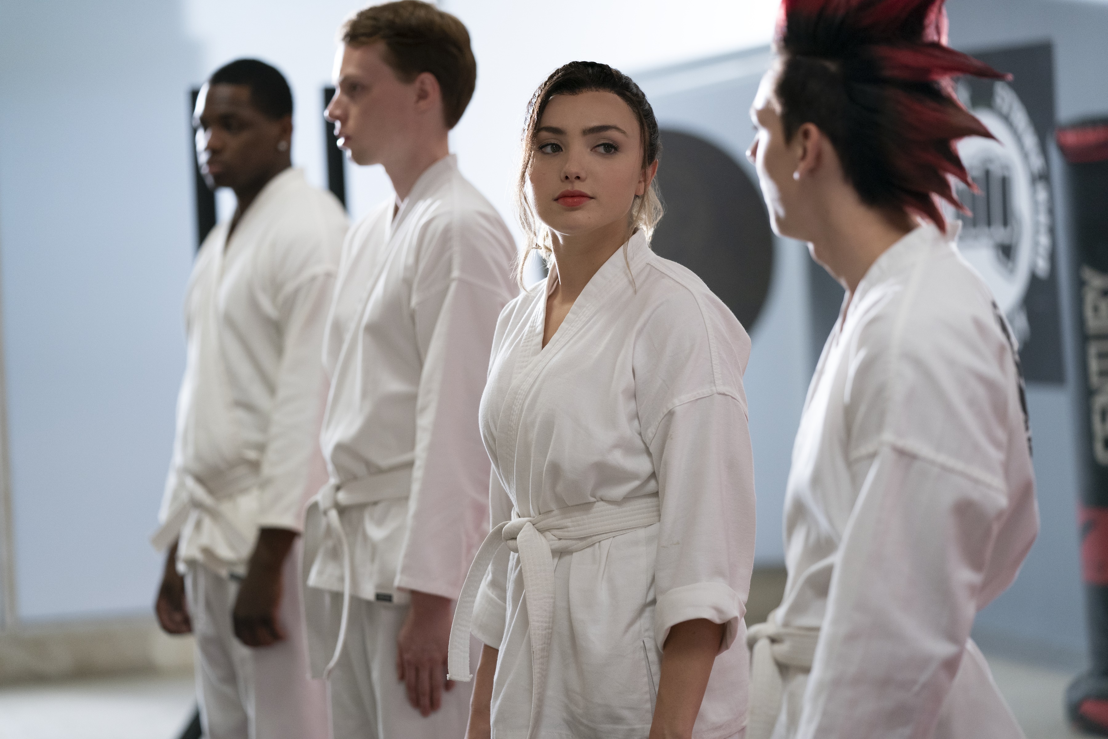 Tory Nichols and other Cobra Kai students in a dojo HD Wallpaper