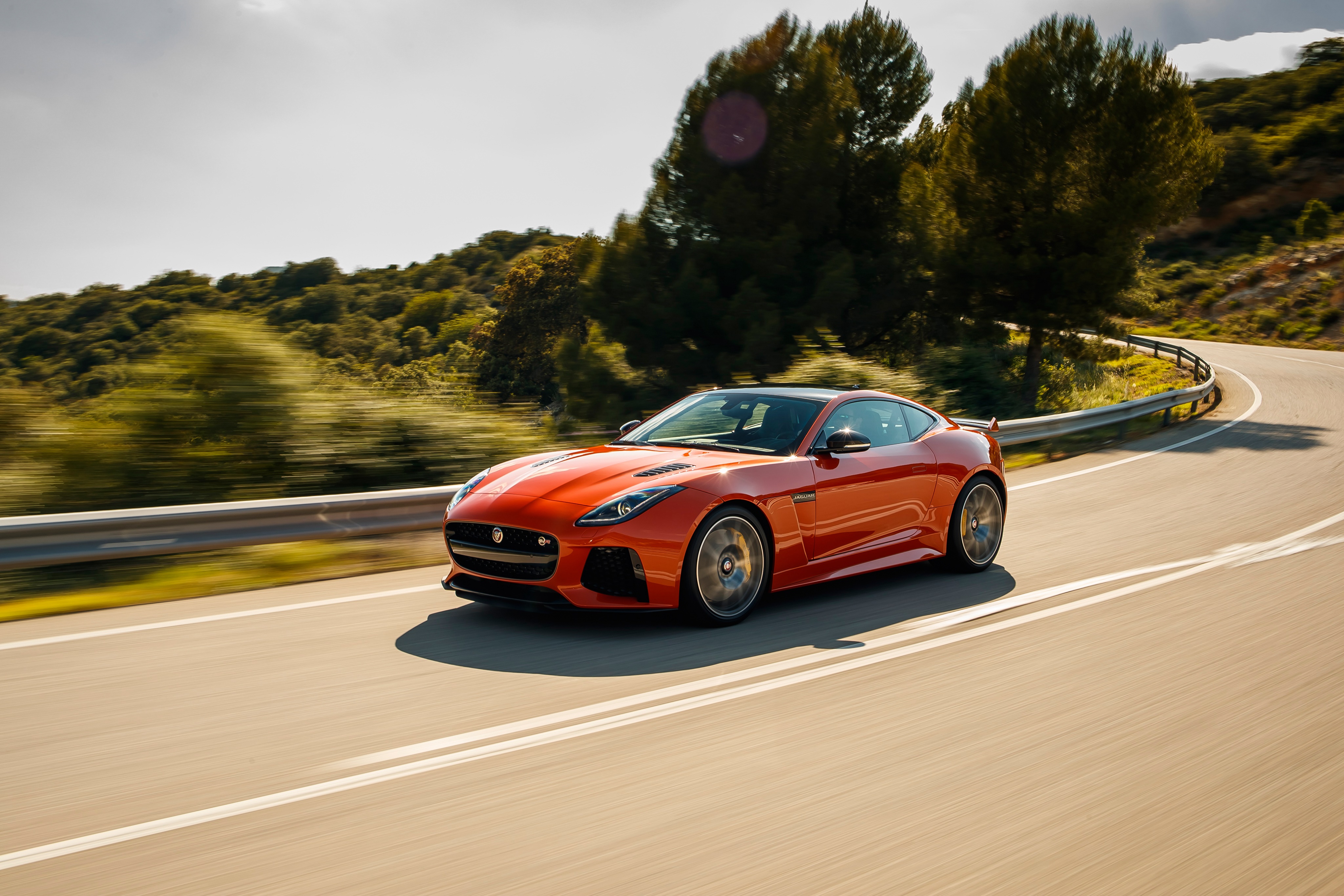 Orange Jaguar F-Type Coupe on a Winding Road HD Wallpaper