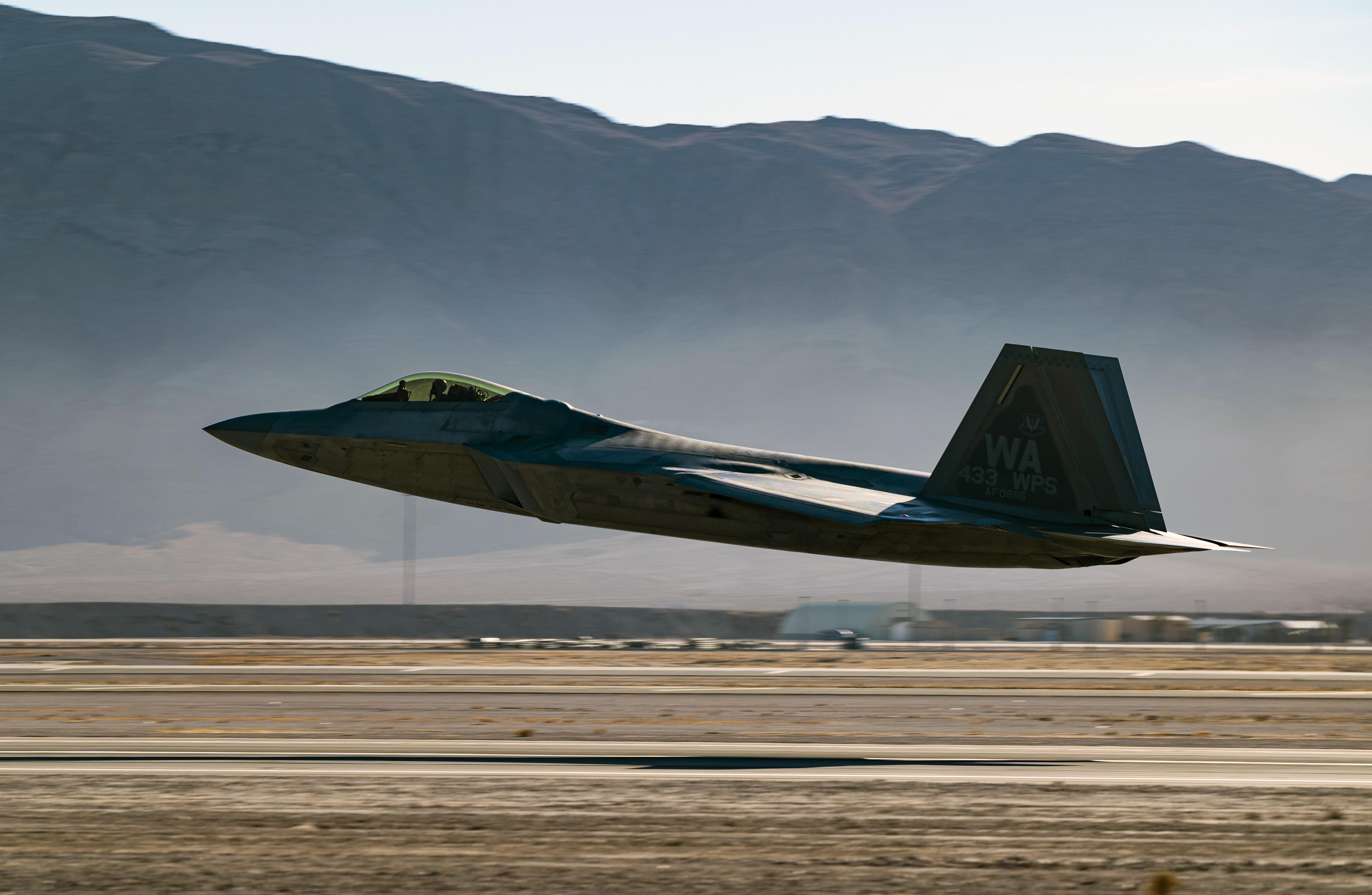 Lockheed Martin F-22 Raptor taking off HD Wallpaper