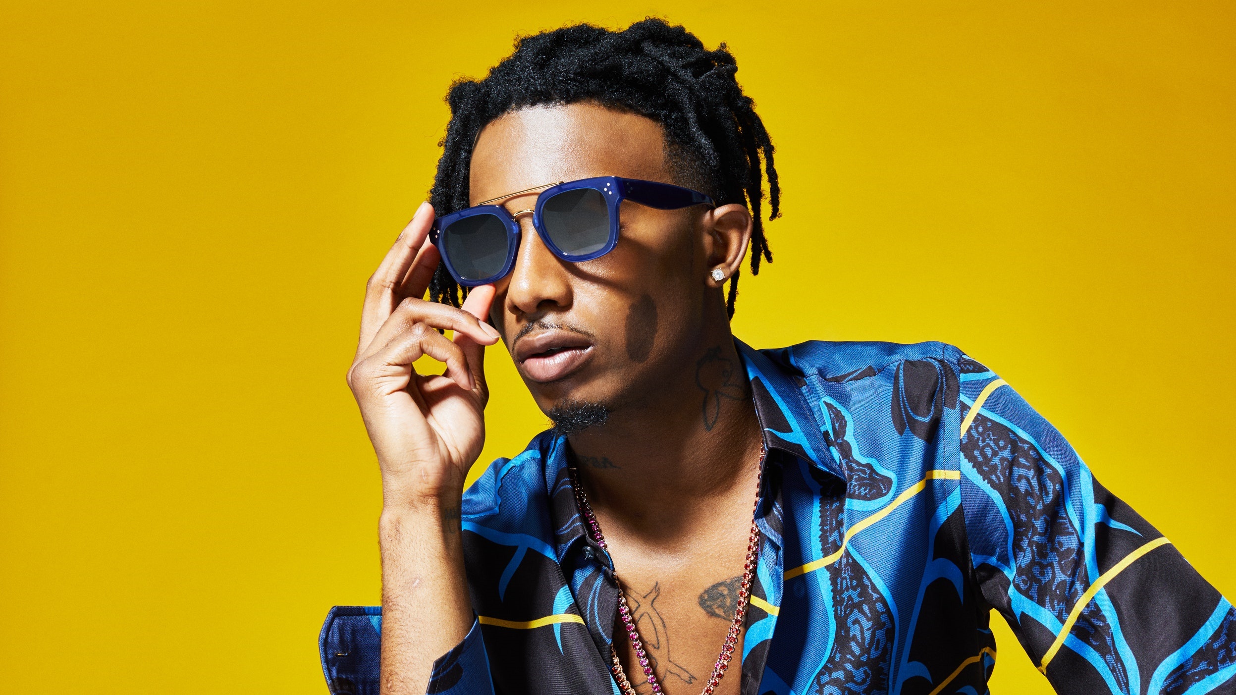 Playboi Carti wearing sunglasses and a blue patterned shirt HD Wallpaper