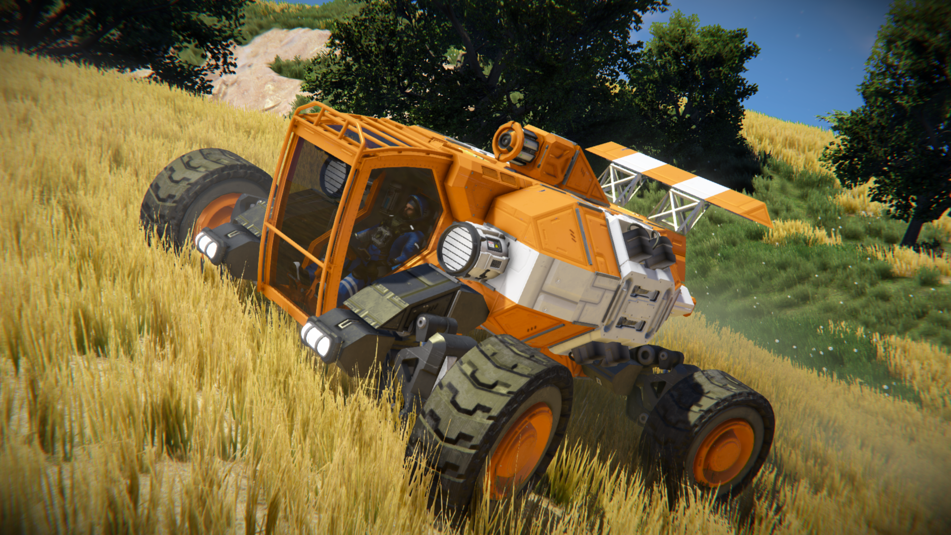 Orange and white rover on a grassy hill in Space Engineers HD Wallpaper