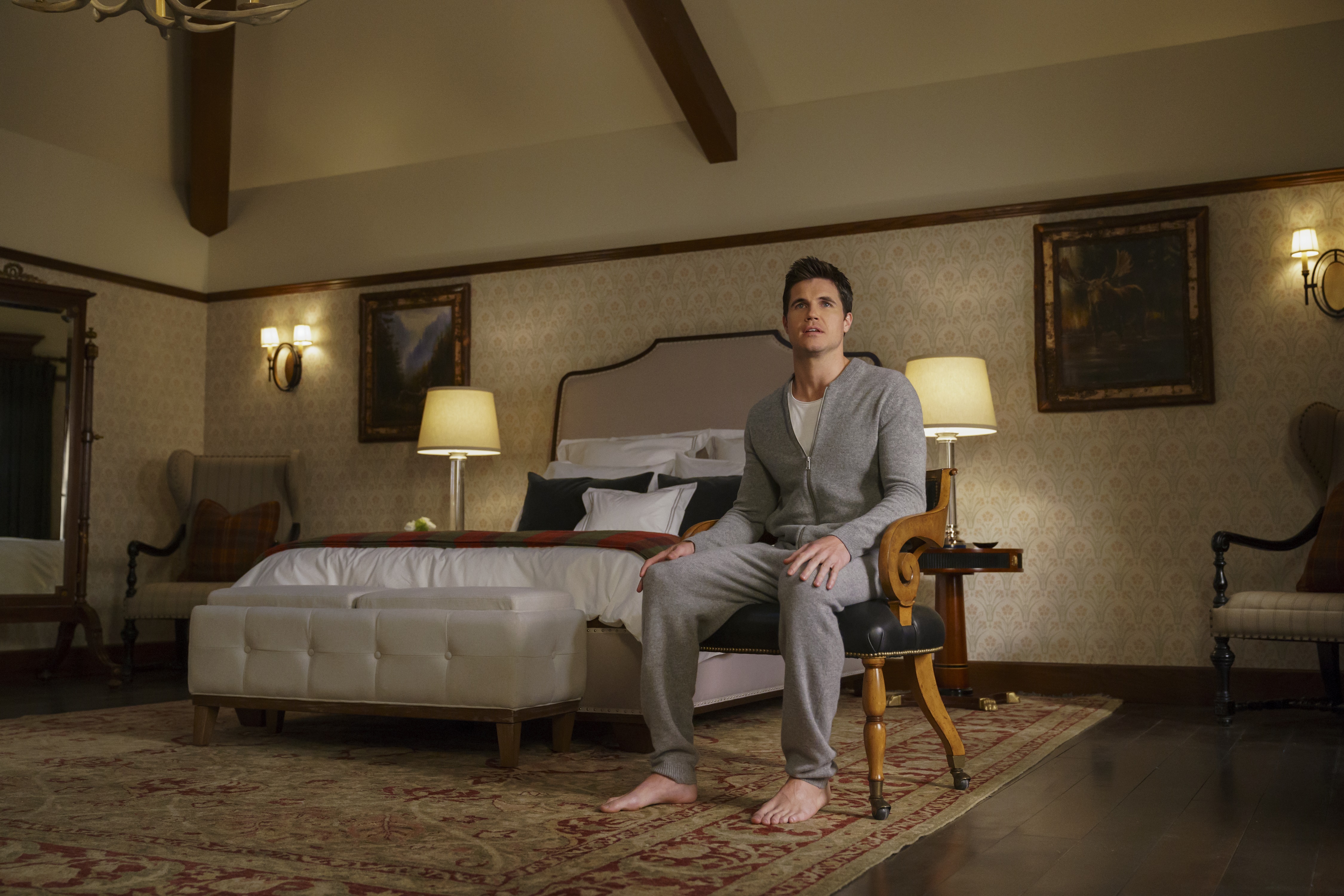 Robbie Amell in a bedroom HD Wallpaper