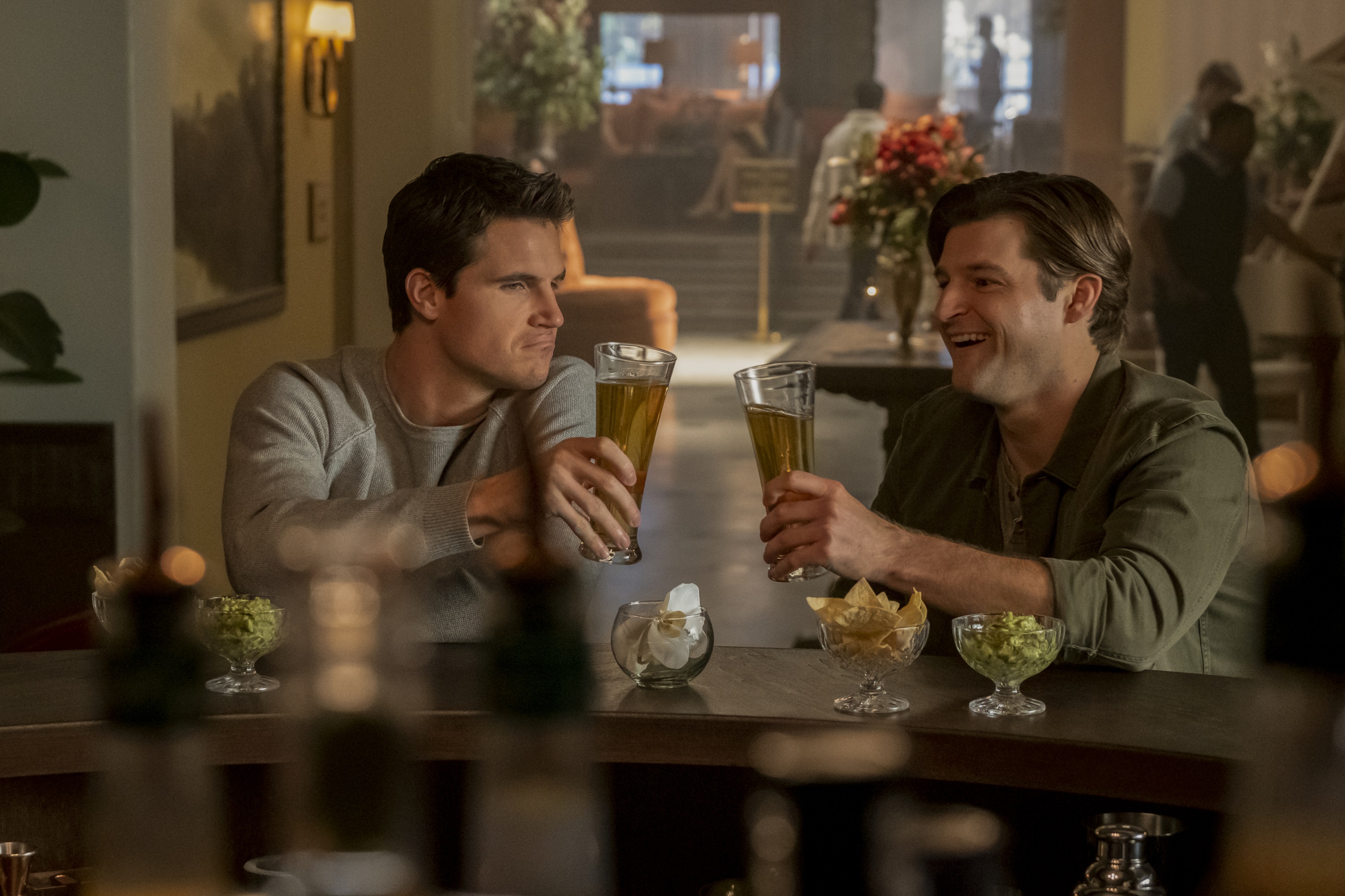 Robbie Amell and Kevin Bigley at a bar HD Wallpaper