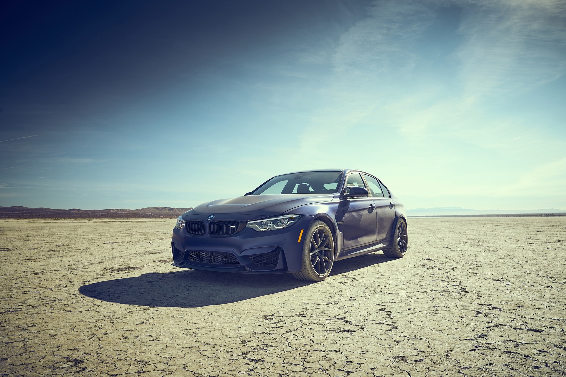 Blue BMW M3 Sedan on Cracked Earth HD Wallpaper