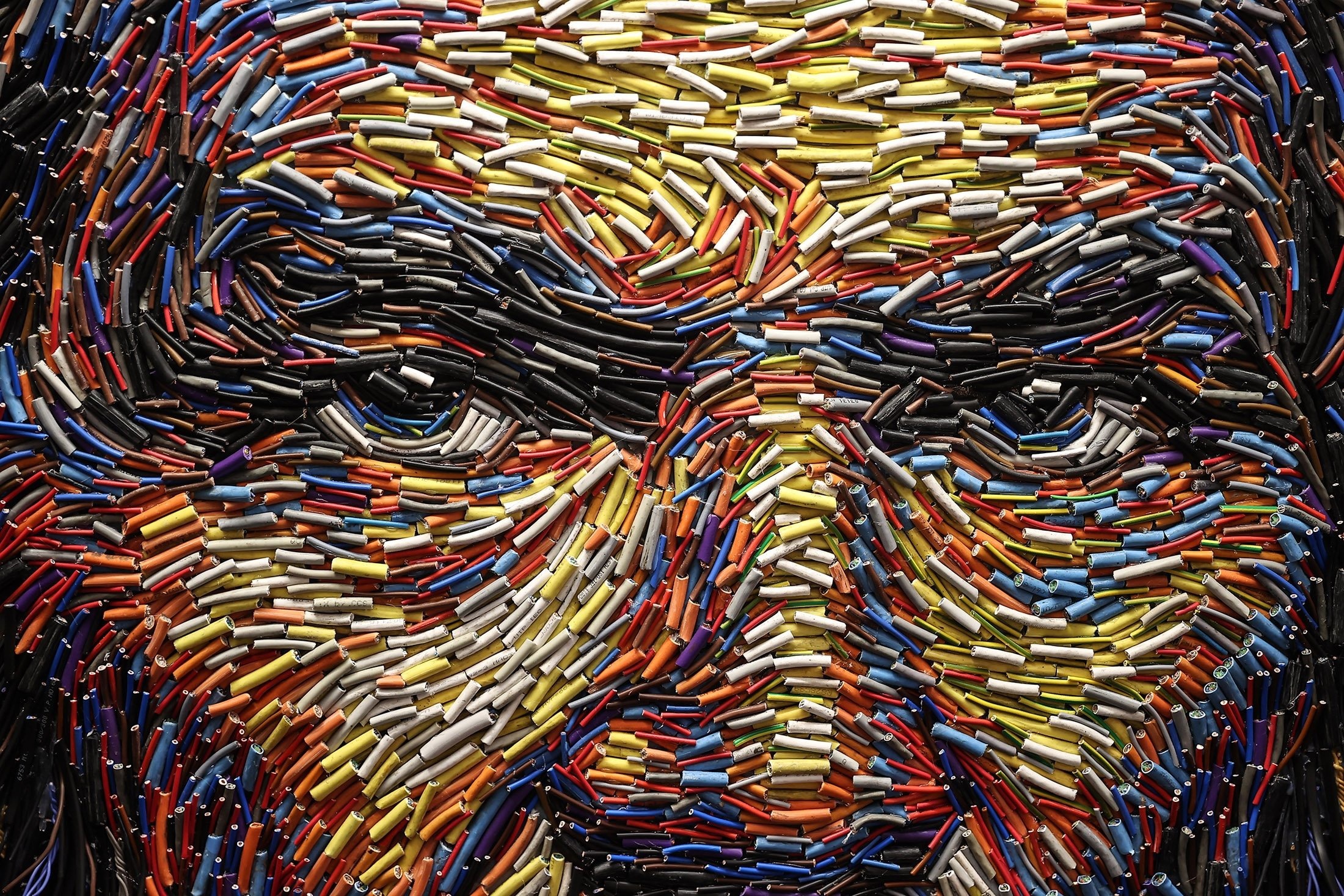 Close-up of a face made of colorful wires HD Wallpaper