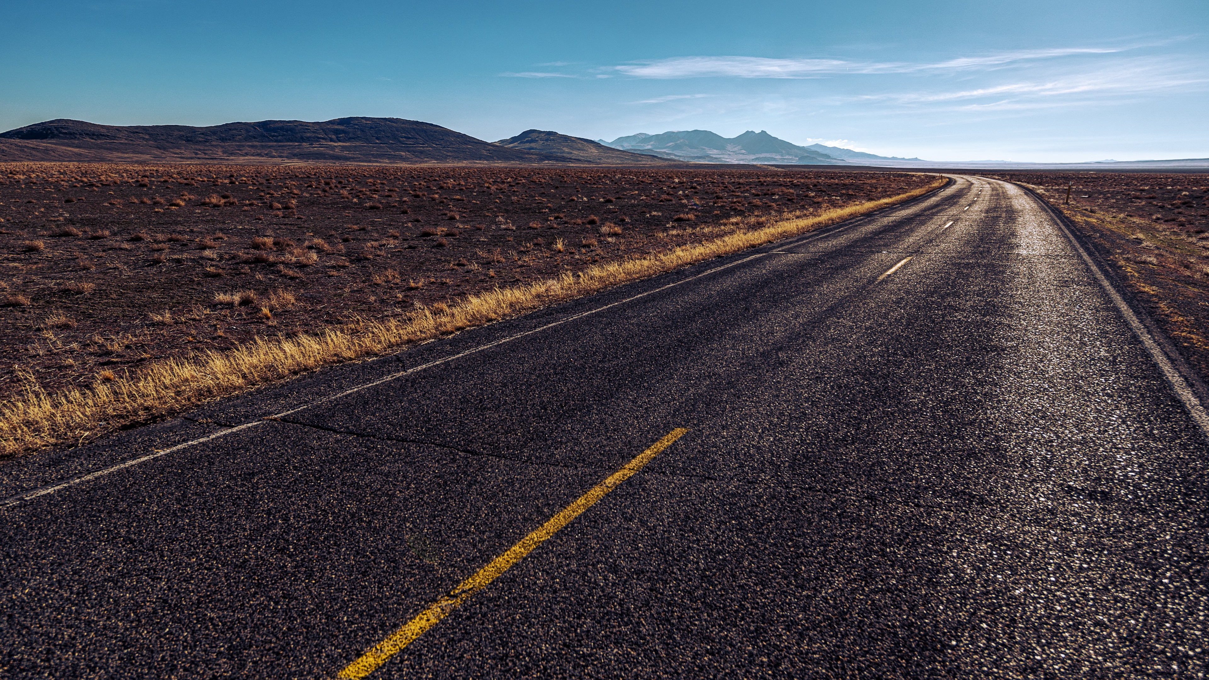 Empty Road Through Arid Landscape HD Wallpaper