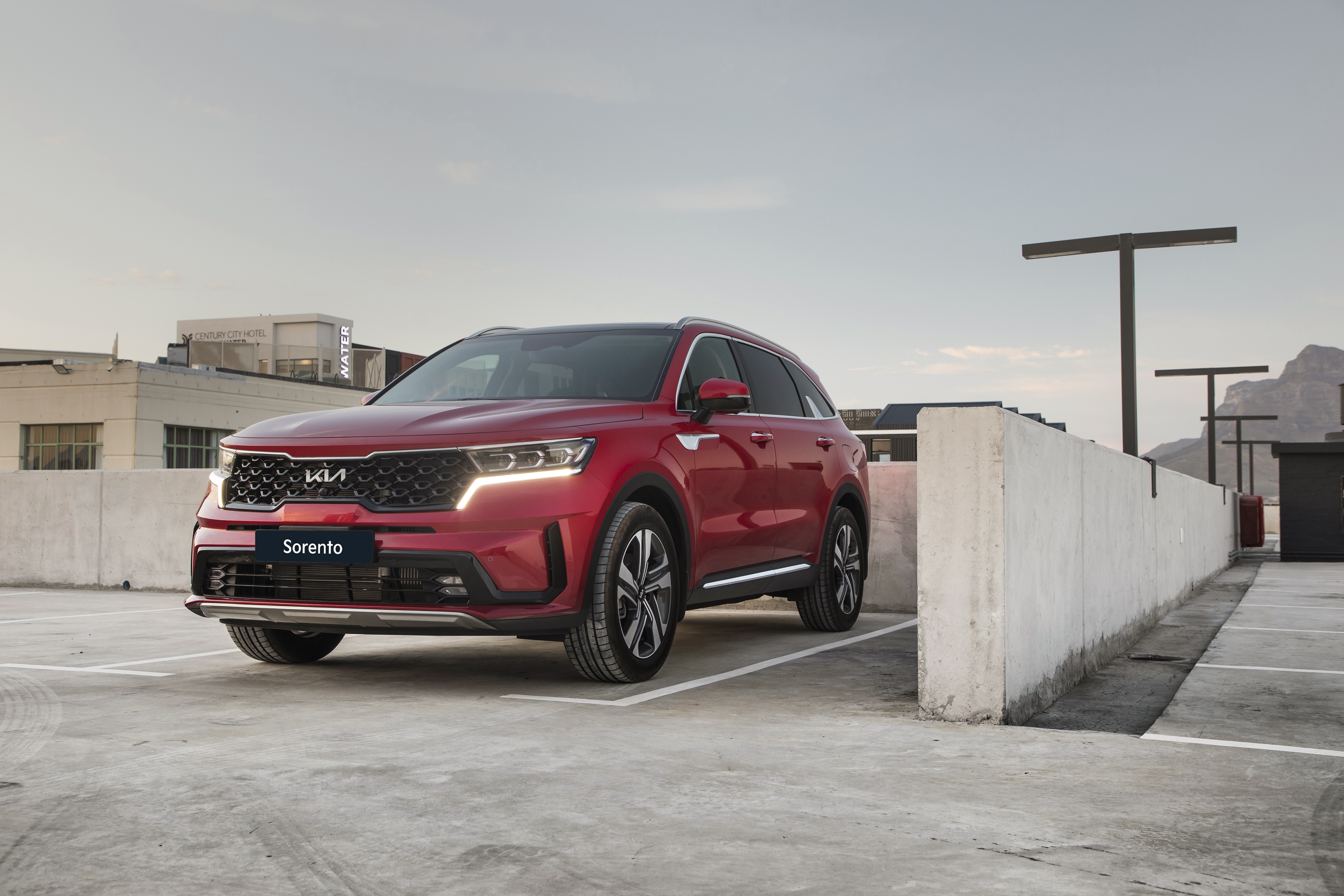 Red Kia Sorento SUV parked in a lot HD Wallpaper