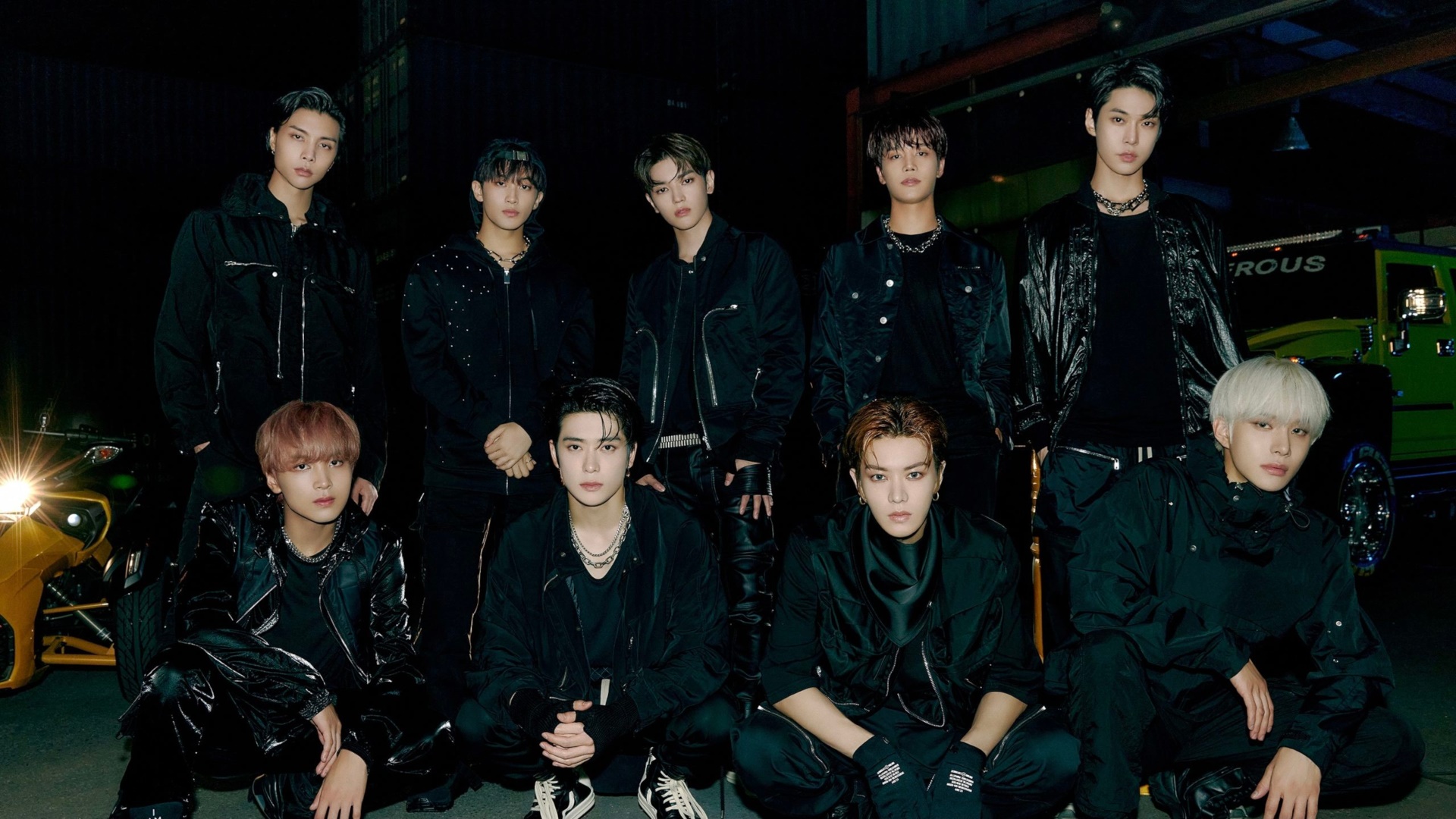 NCT members in black outfits with a car HD Wallpaper