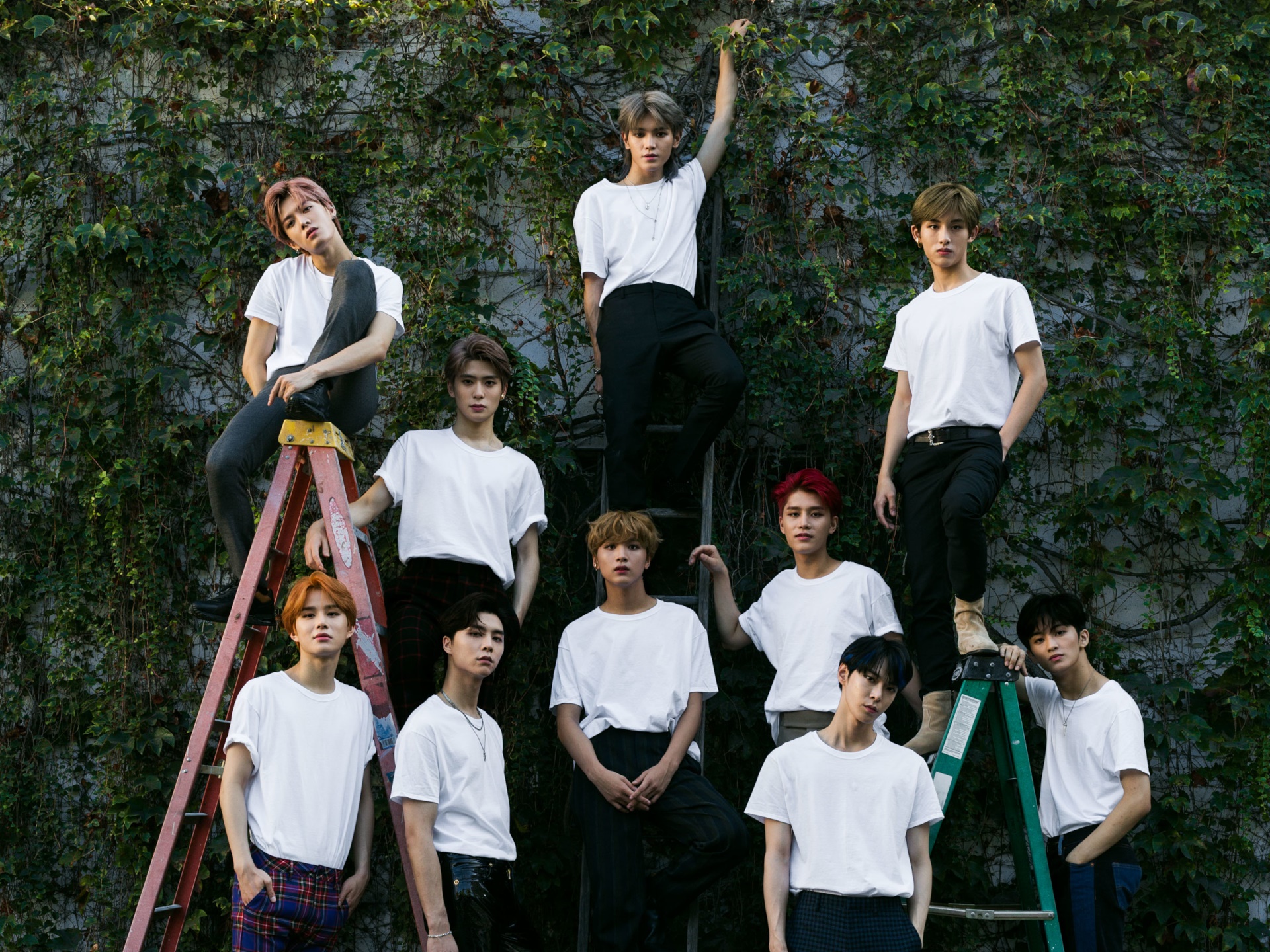 NCT members posing on ladders outdoors HD Wallpaper