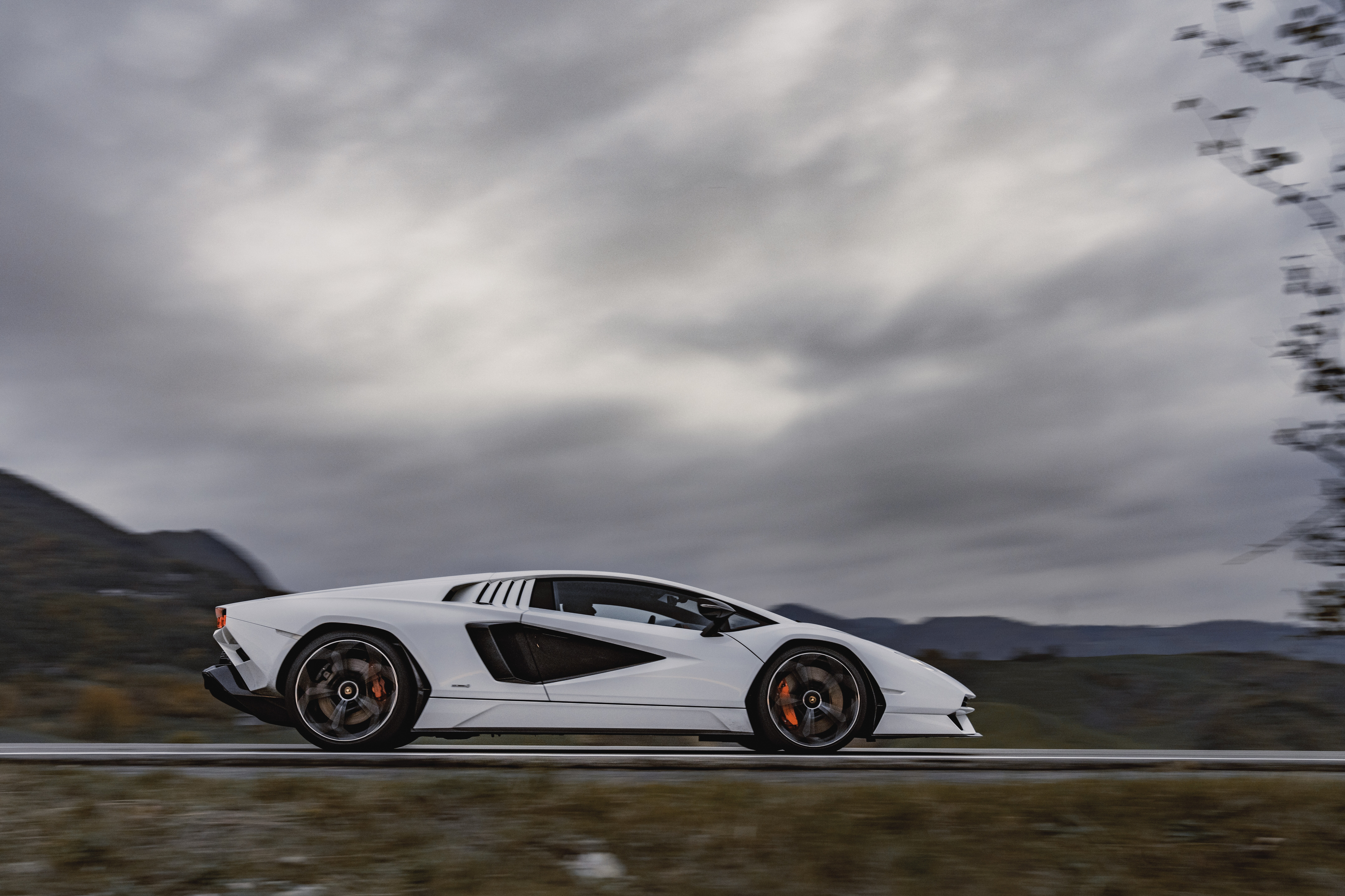 White Lamborghini Countach LPI 800-4 driving on a road HD Wallpaper