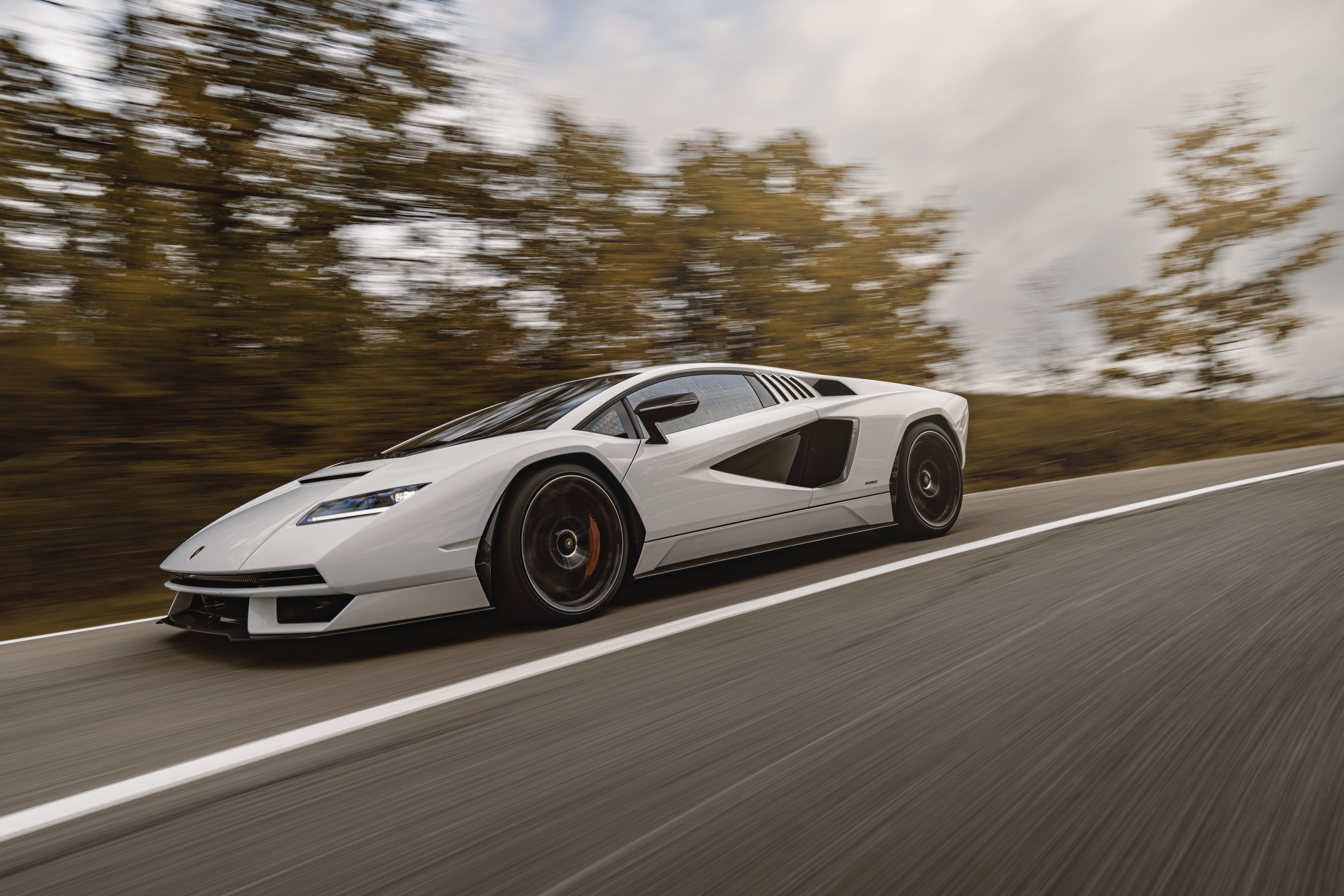 White Lamborghini Countach LPI 800-4 driving on a road HD Wallpaper