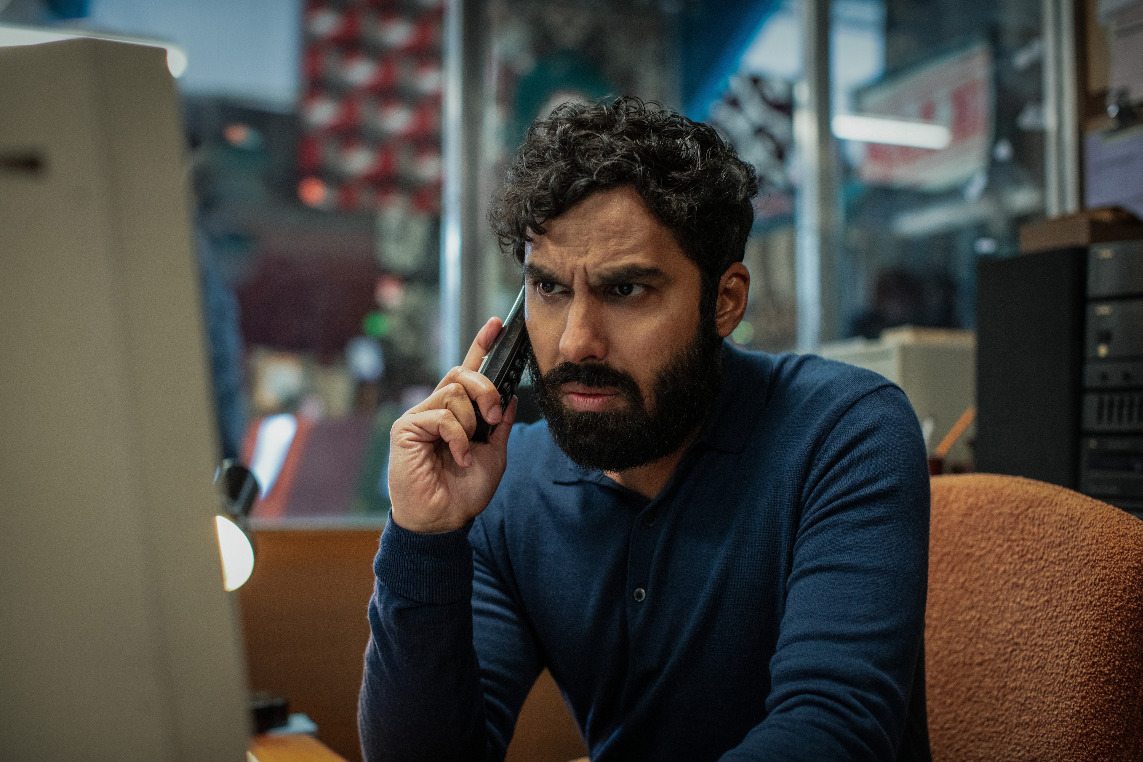 Kunal Nayyar on the phone HD Wallpaper