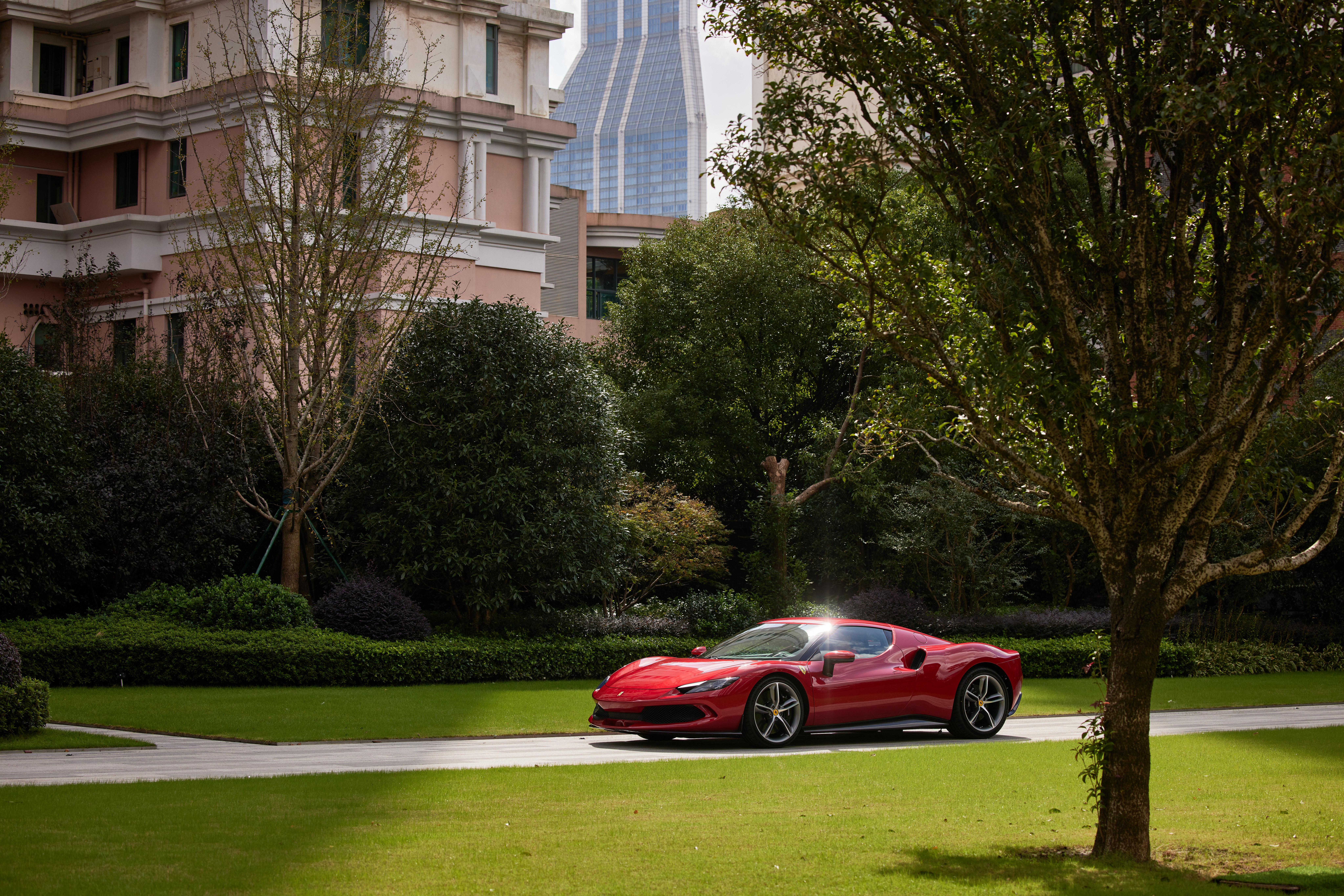 Red Ferrari 296 GTB Supercar on a Road HD Wallpaper