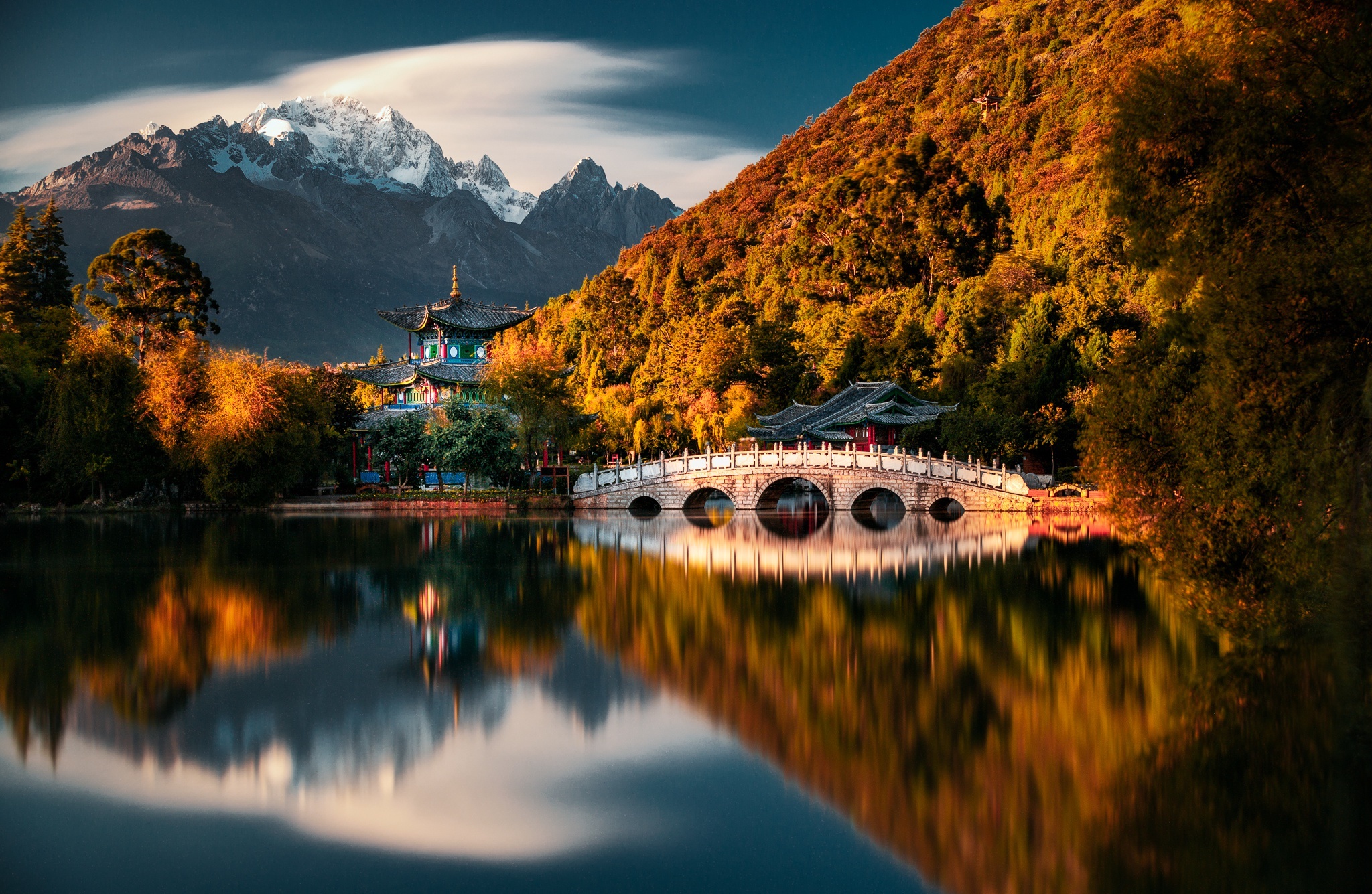 Pagoda reflection on a lake with mountains and autumn trees HD Wallpaper