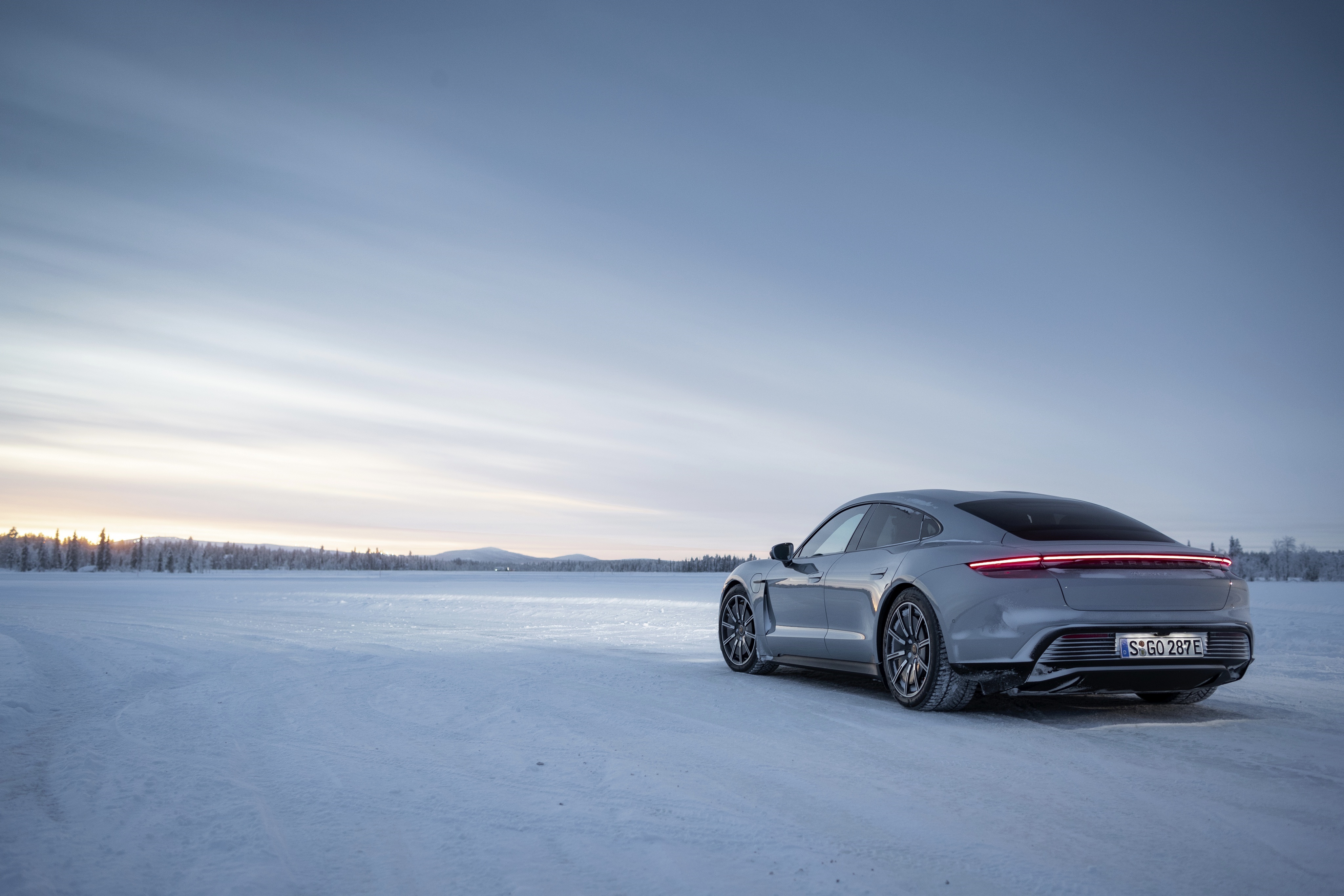 Porsche Taycan 4S on a snowy landscape HD Wallpaper