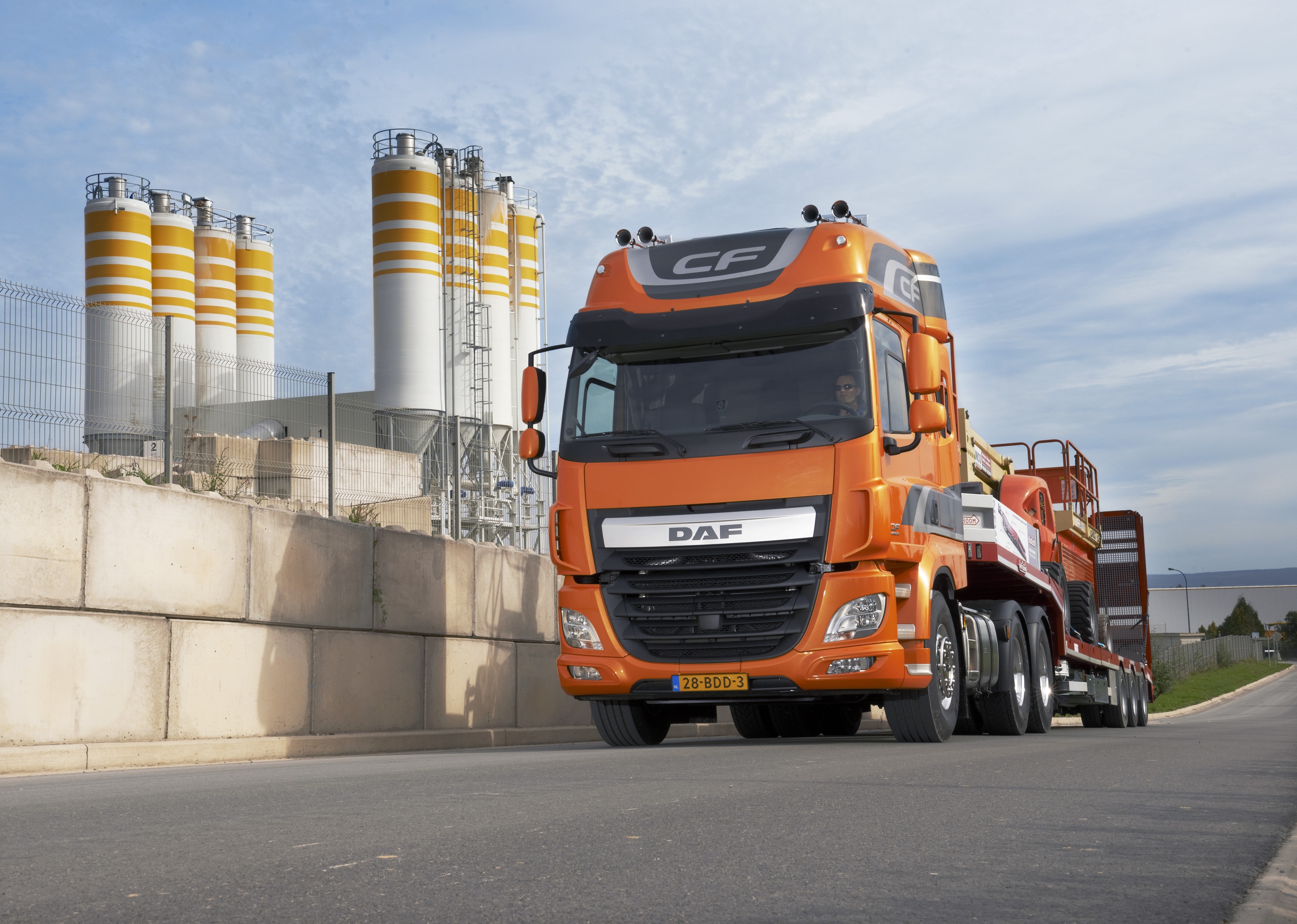 Orange DAF CF truck at a concrete plant HD Wallpaper