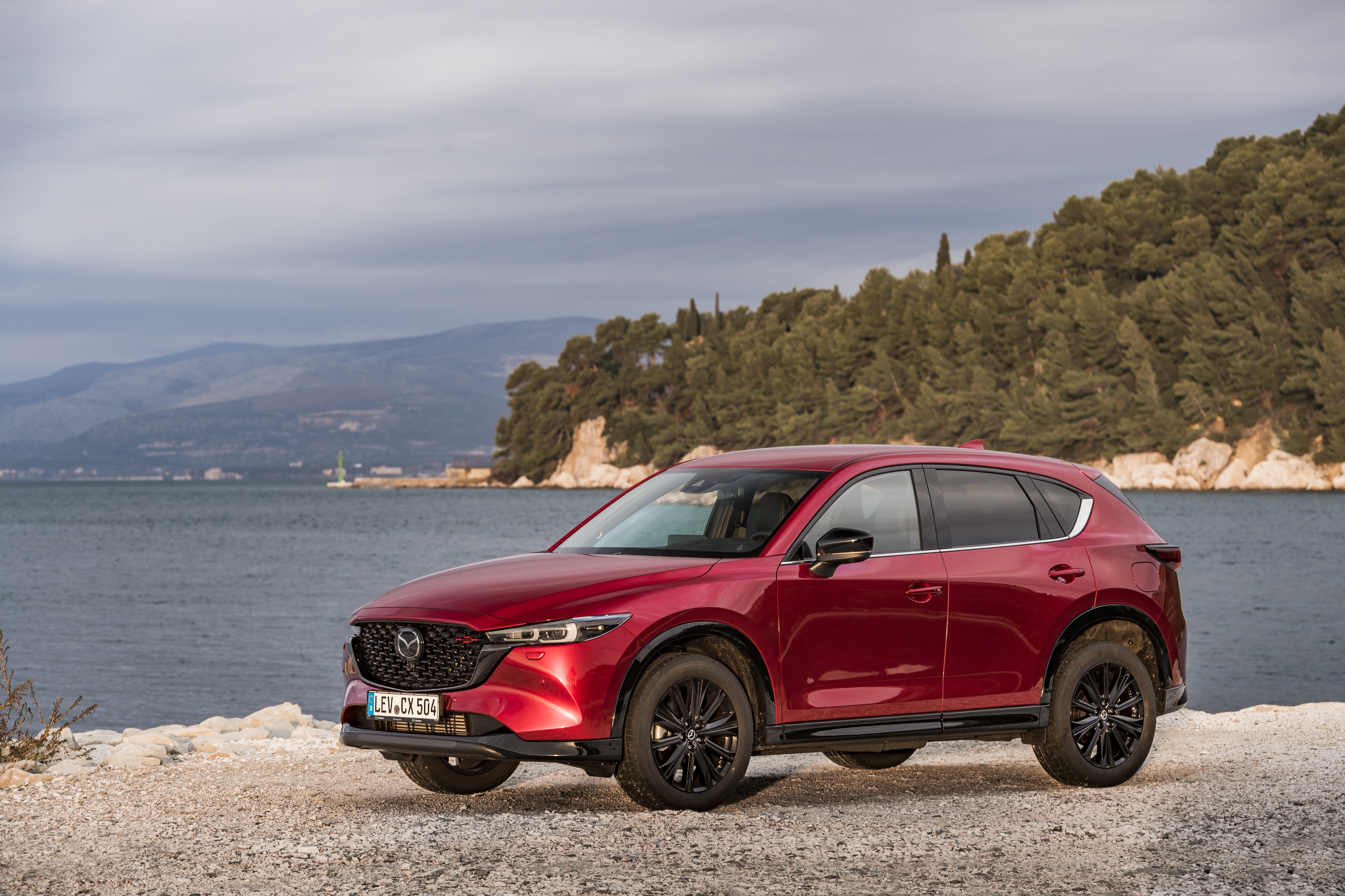 Red Mazda CX-5 Skyactiv-D 4K SUV parked by the sea HD Wallpaper