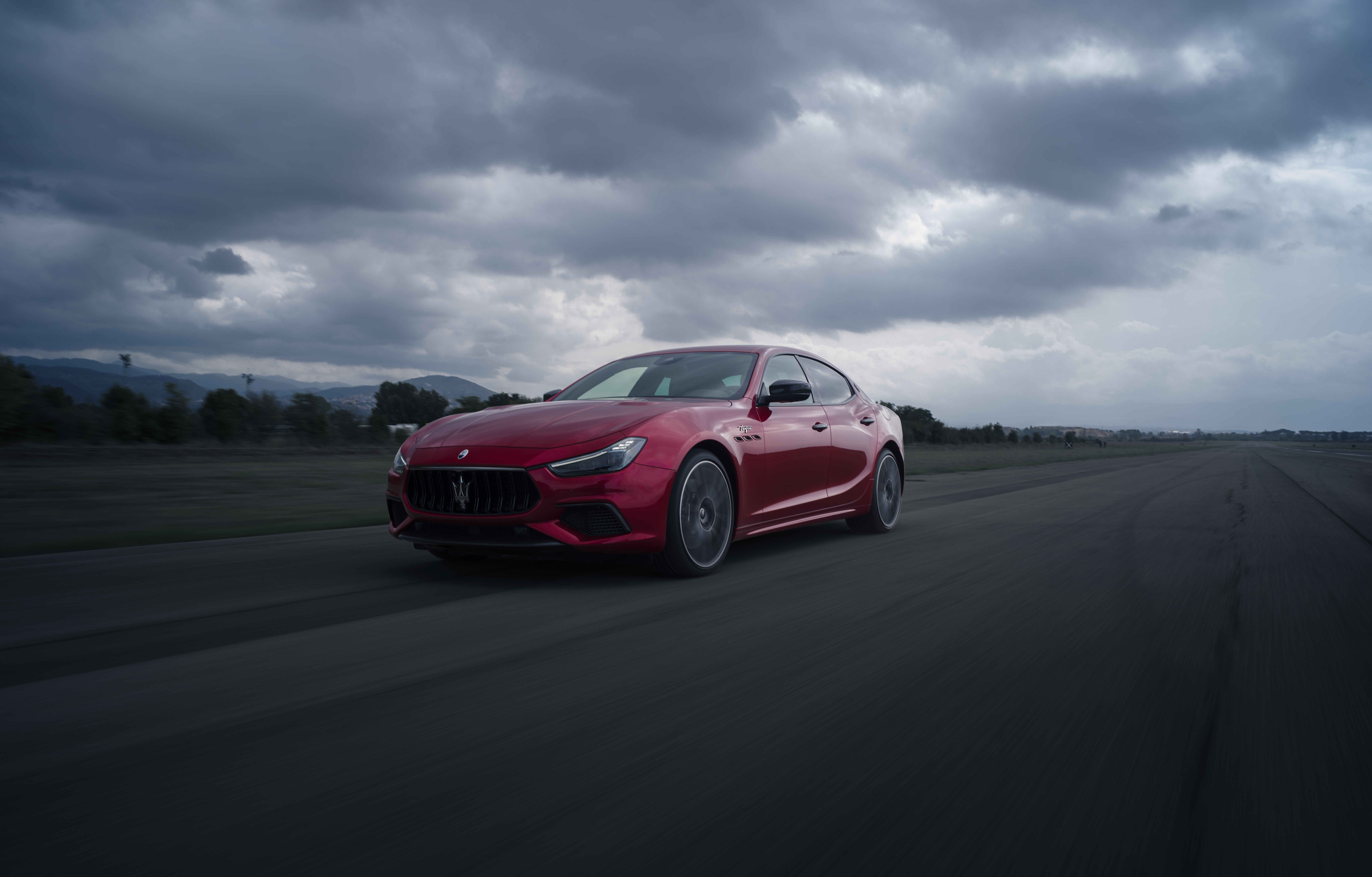 Red Maserati Ghibli Trofeo on a Racetrack HD Wallpaper