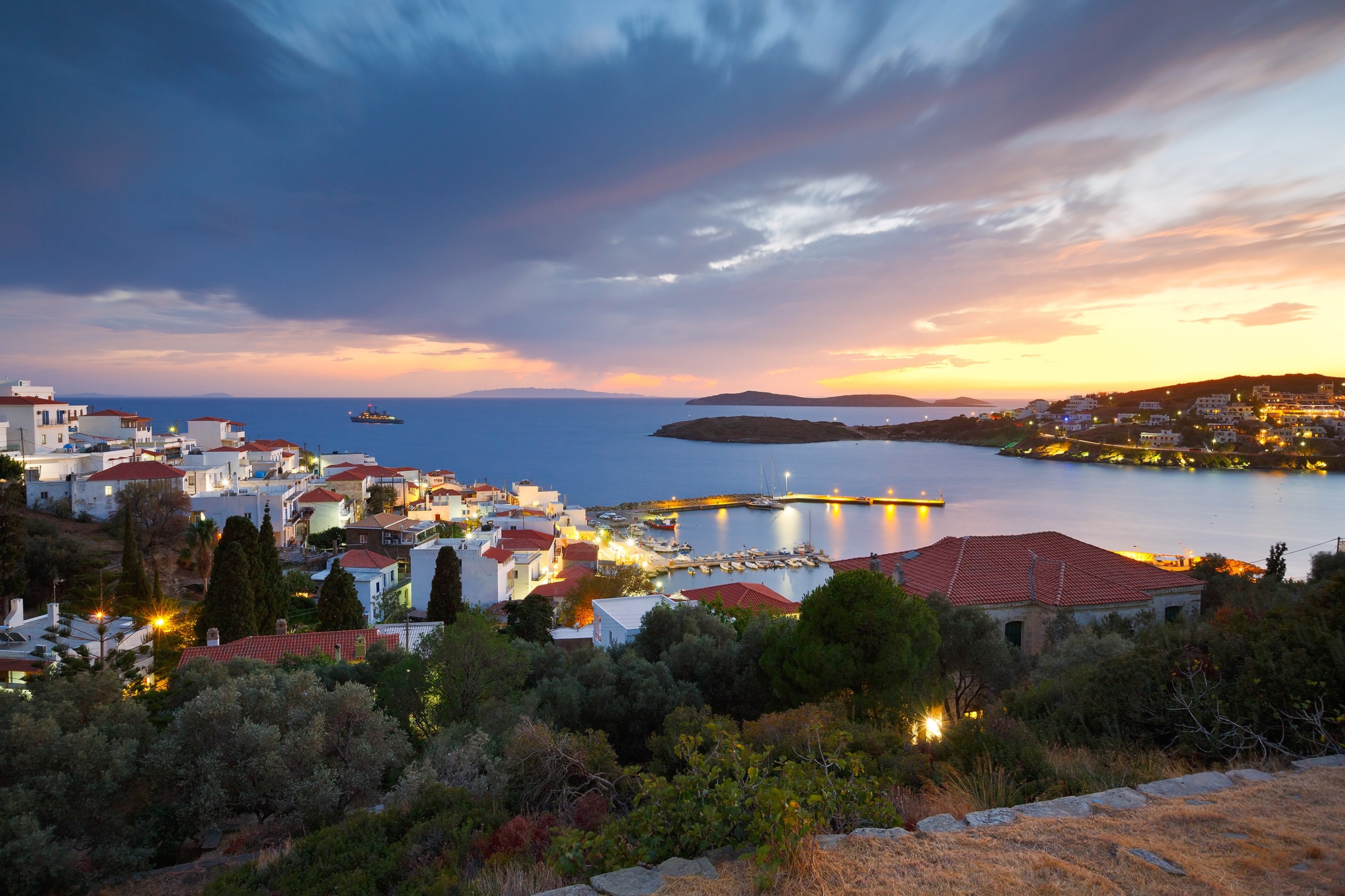 Coastal town on Andros Island, Greece at dusk HD Wallpaper