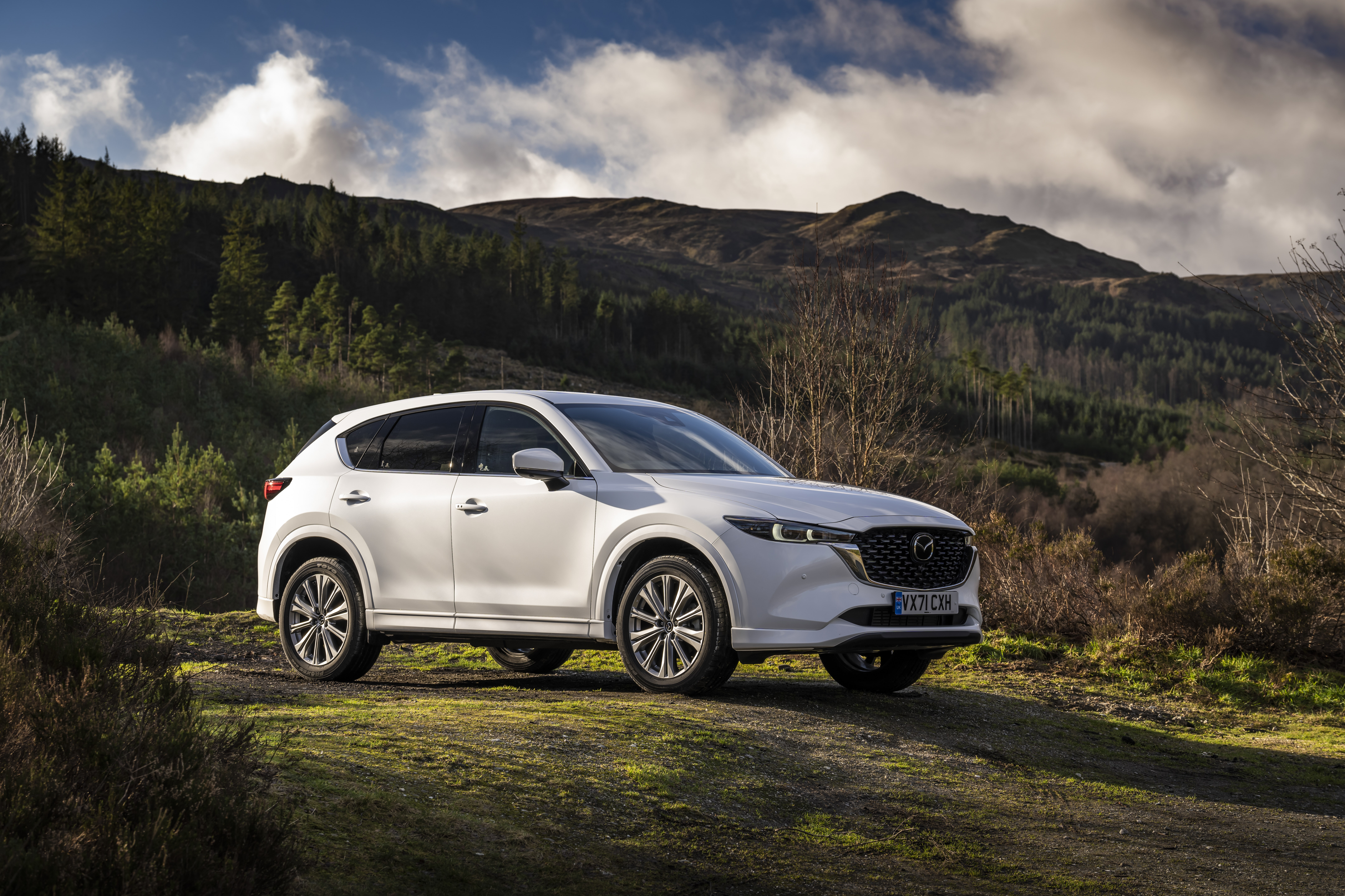White Mazda CX-5 SUV parked on a dirt road HD Wallpaper