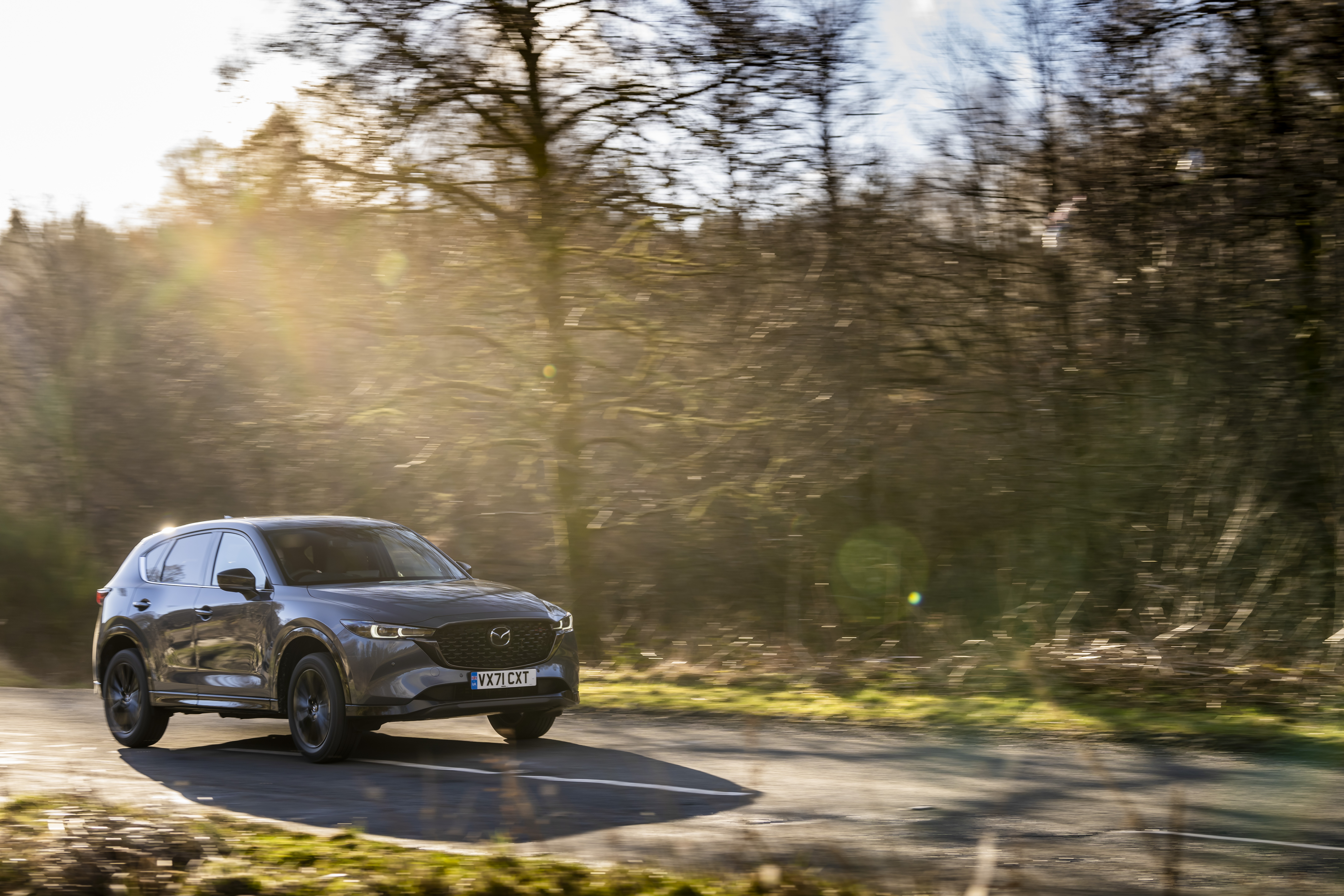 Mazda CX-5 Skyactiv-G Sport Black SUV driving on road HD Wallpaper