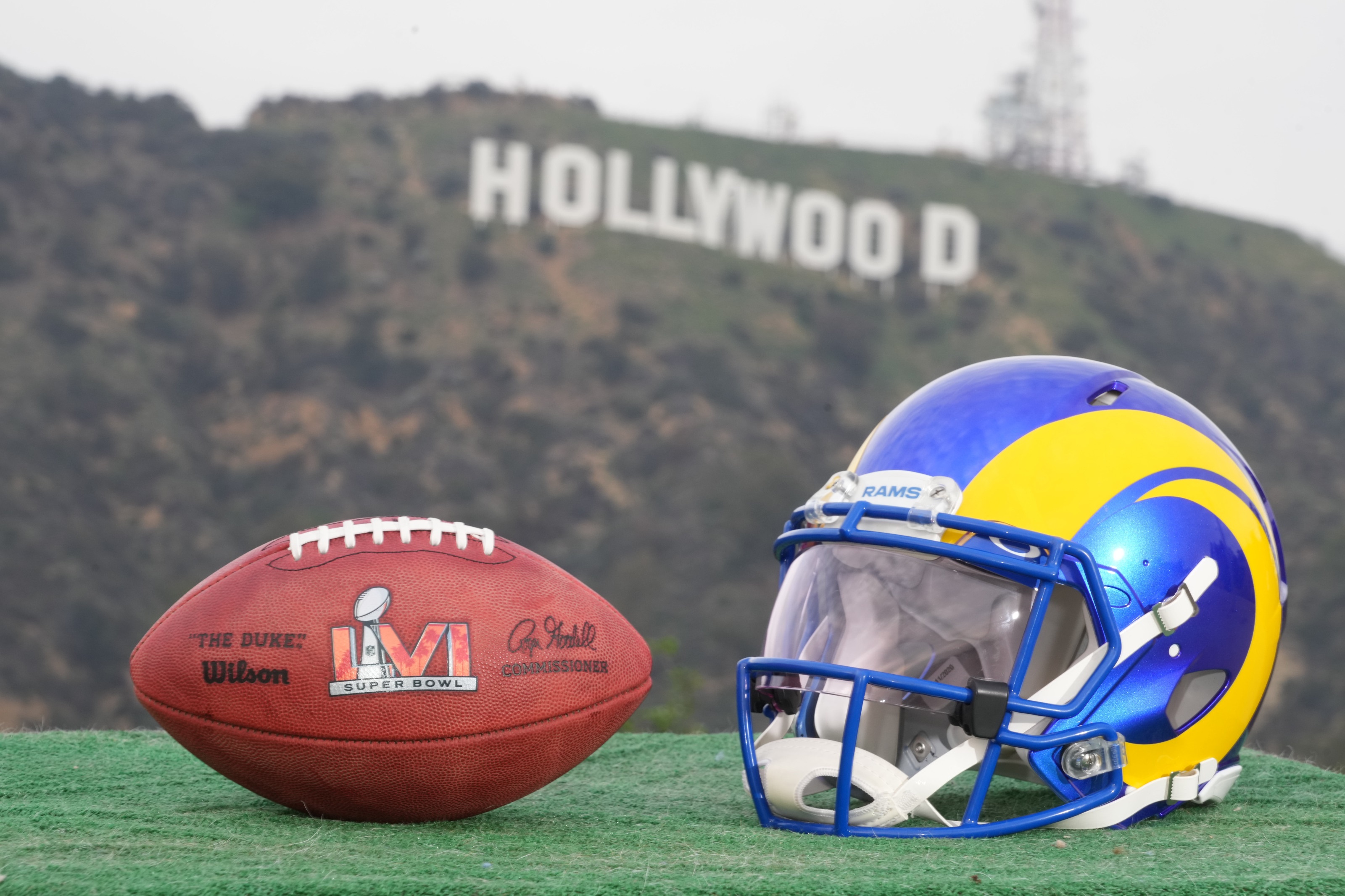 Super Bowl LVI football and Rams helmet with Hollywood sign HD Wallpaper