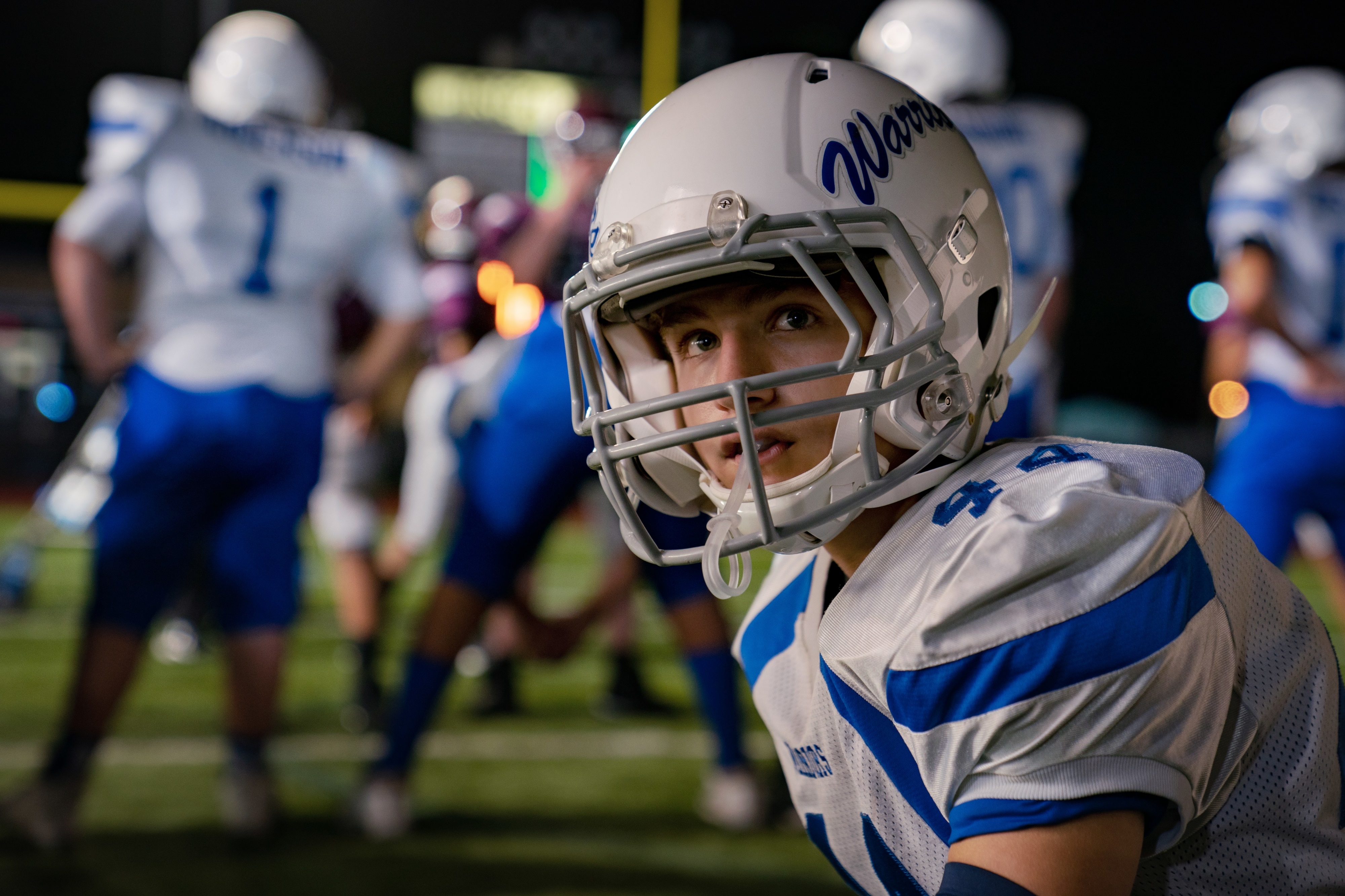 Football player with "Warriors" helmet HD Wallpaper