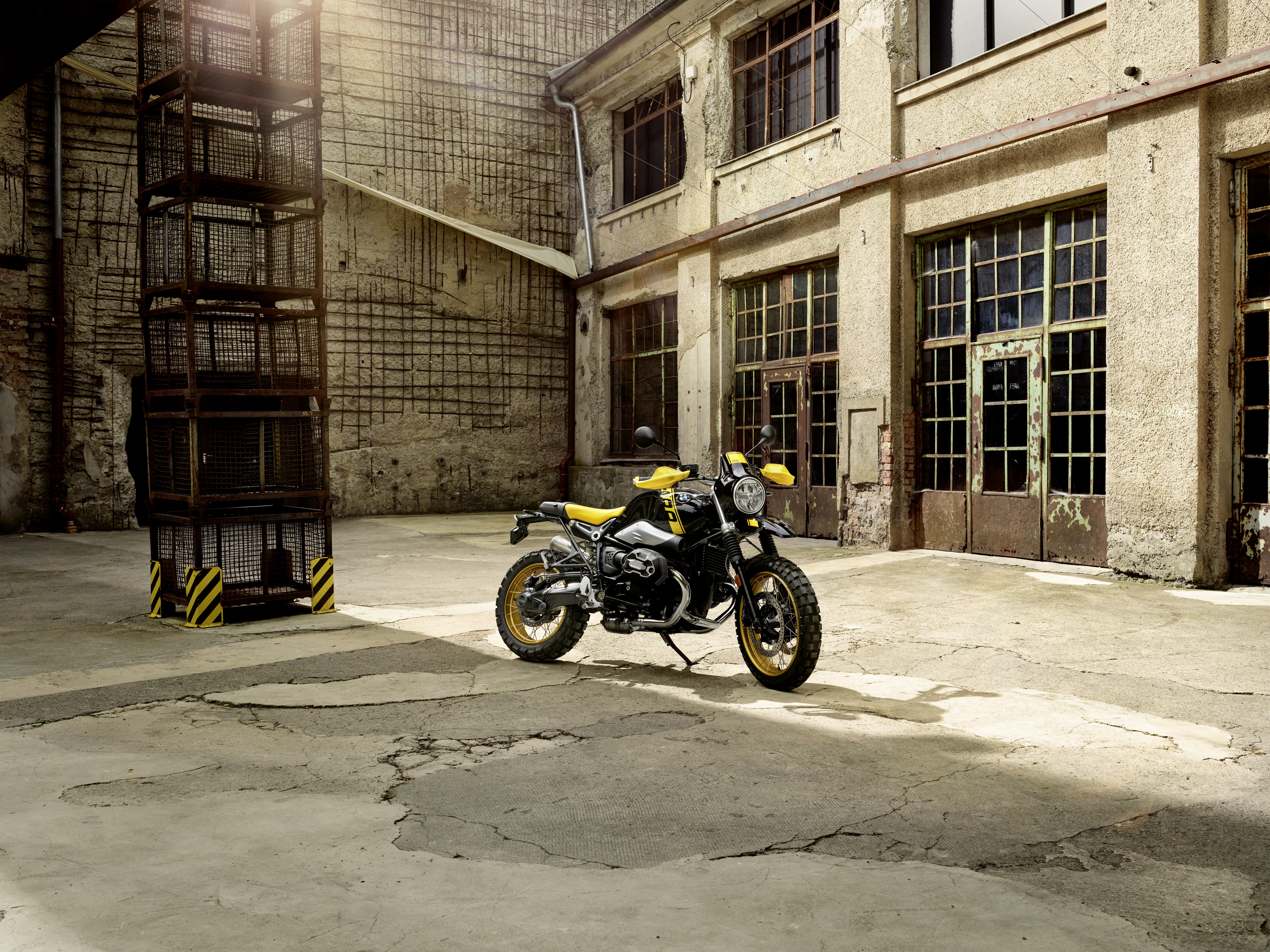 BMW R NineT motorcycle in an industrial courtyard HD Wallpaper