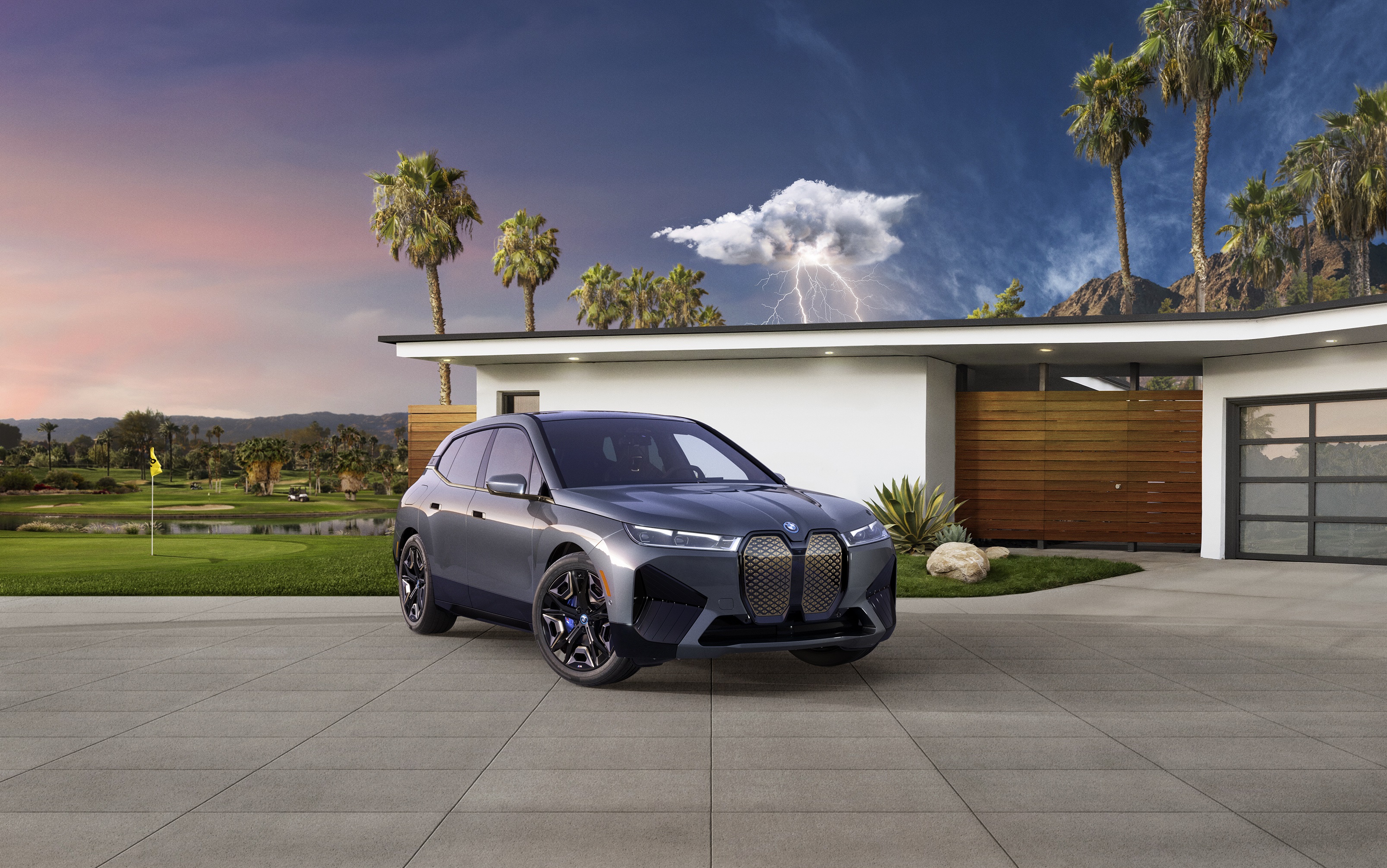 BMW iX M60 SUV parked in front of a modern house HD Wallpaper