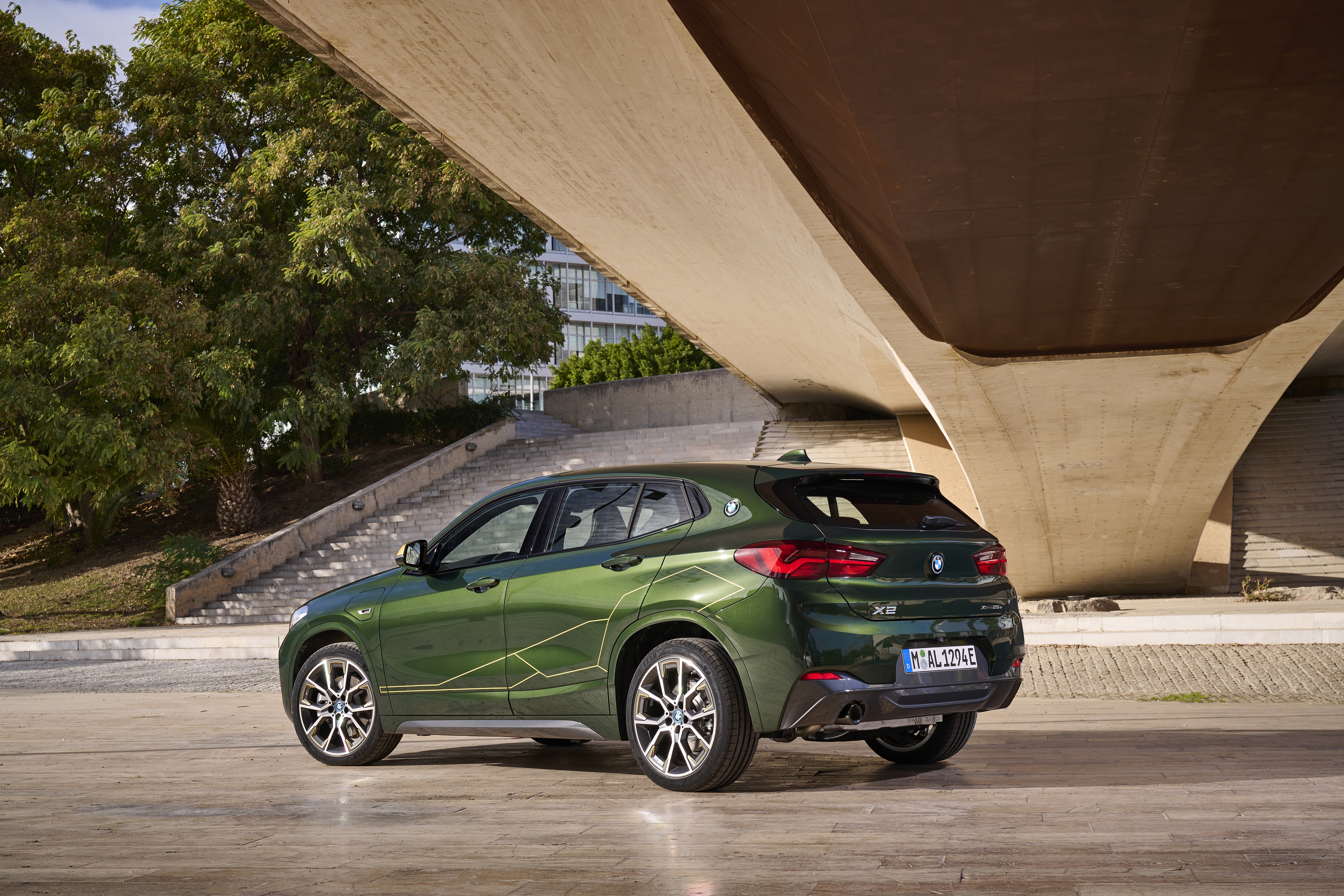 Green BMW X2 xDrive25e parked under a bridge HD Wallpaper
