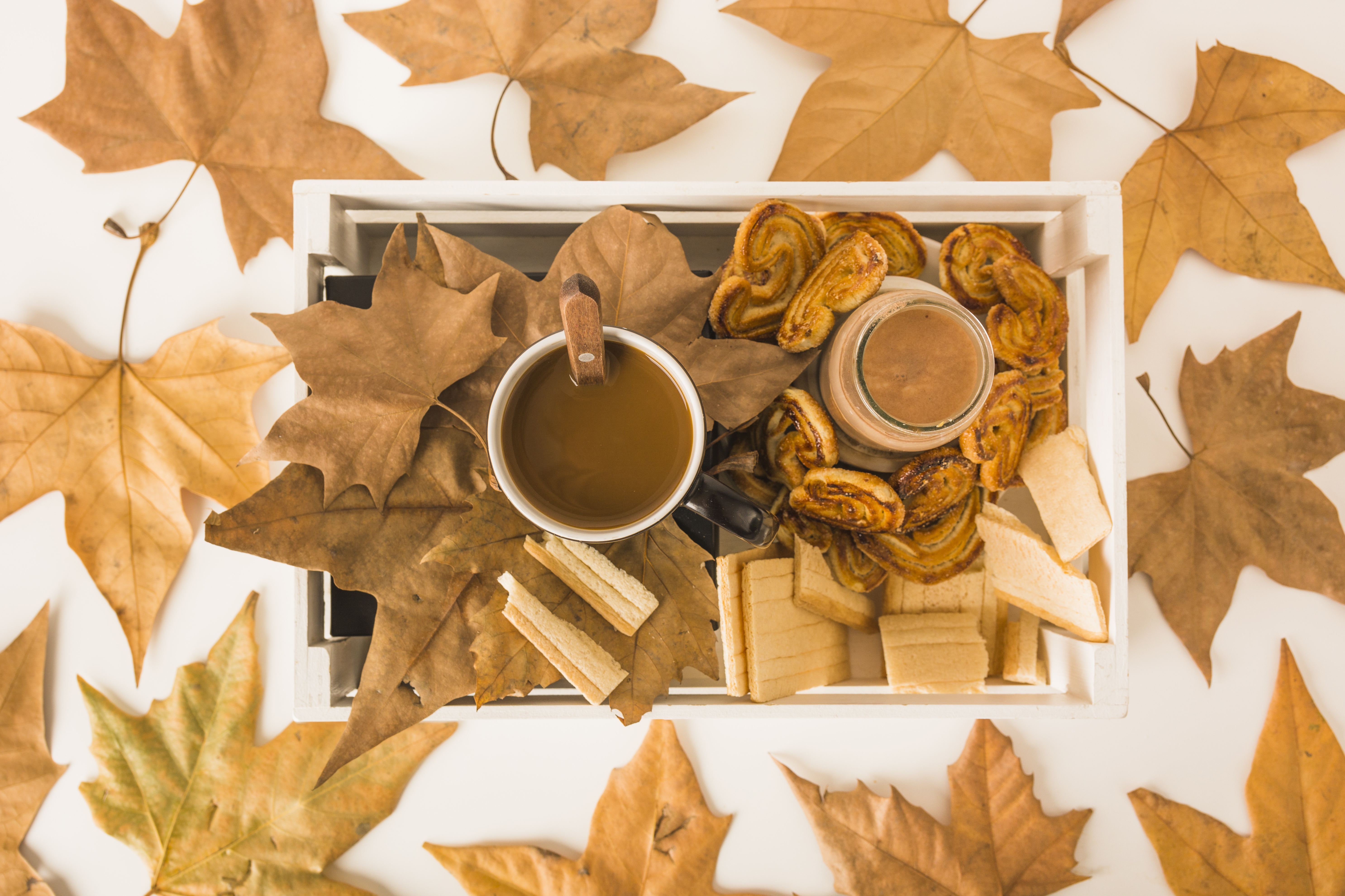 Coffee and pastries on a tray with autumn leaves HD Wallpaper