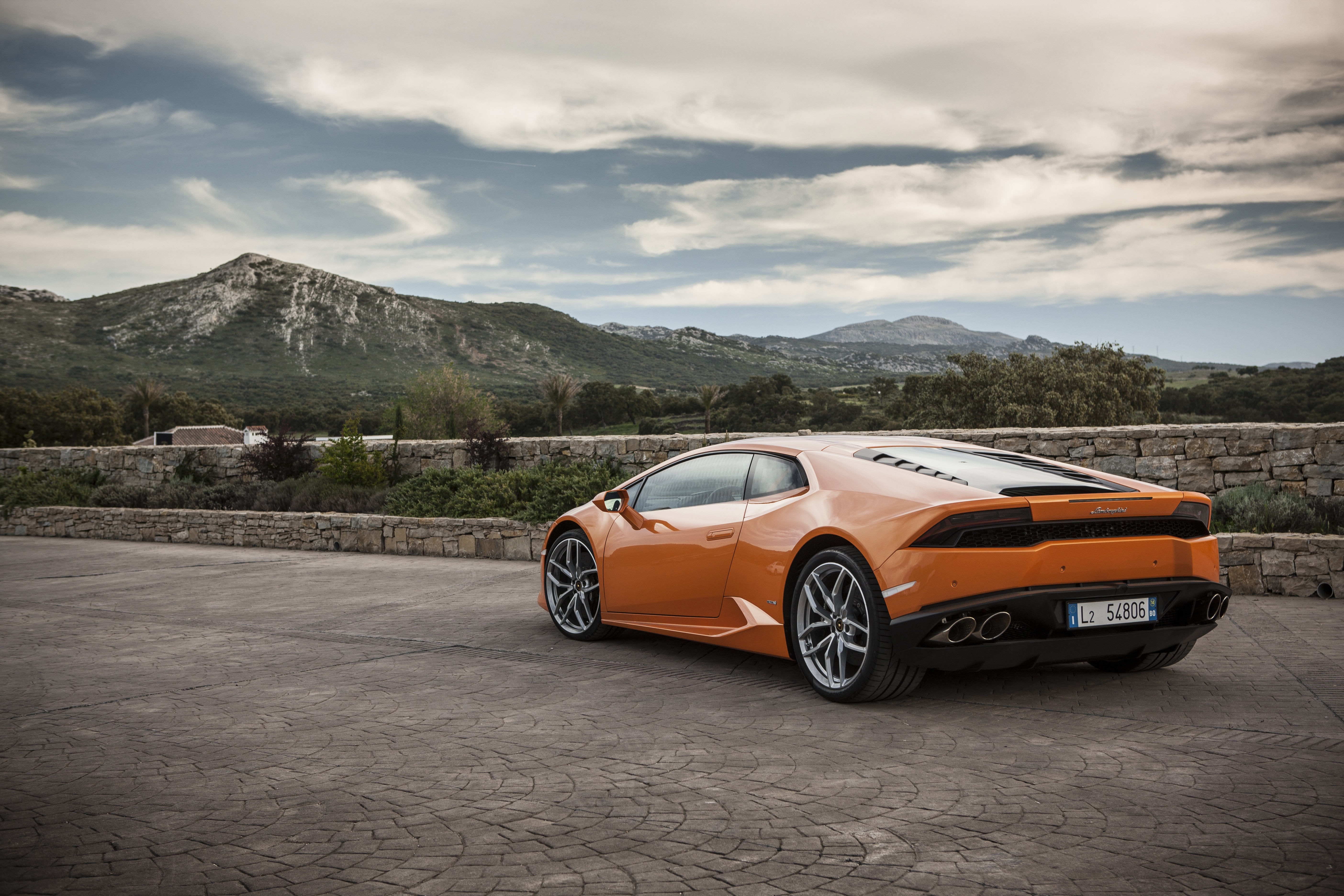 Orange Lamborghini Huracan LP 610-4 on paved area HD Wallpaper