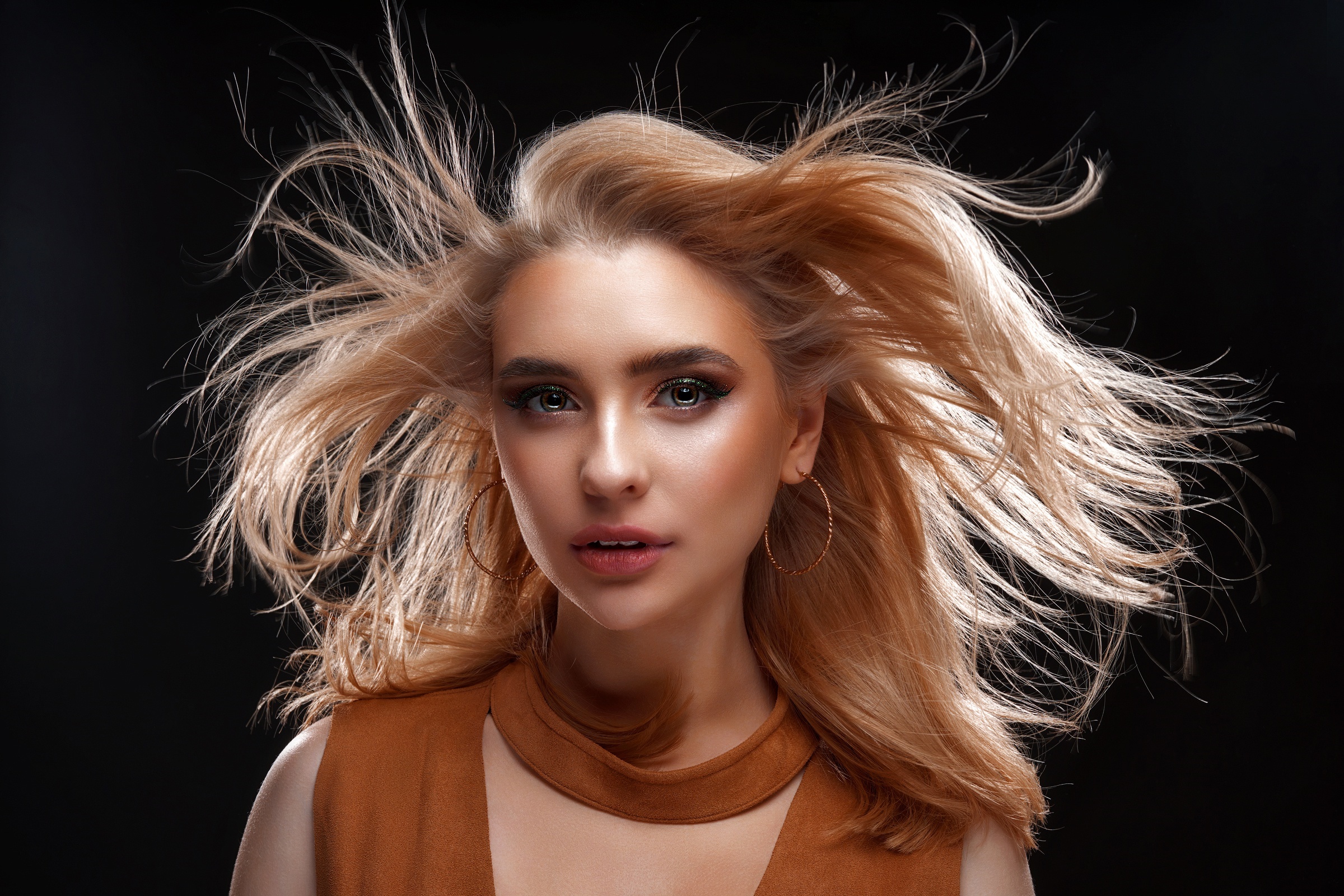 Woman with blonde hair blowing in the wind HD Wallpaper