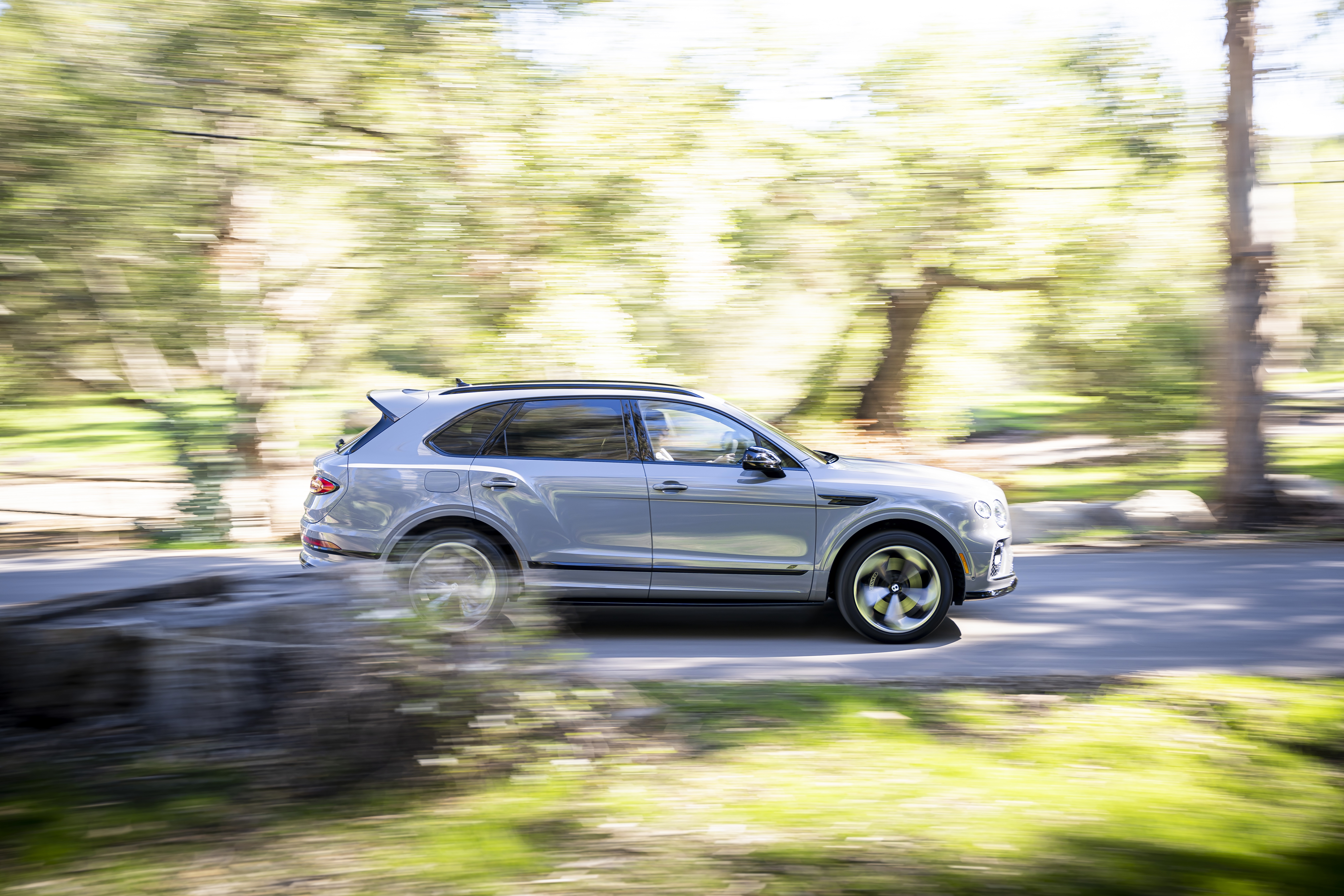 Bentley Bentayga S SUV driving on a road HD Wallpaper