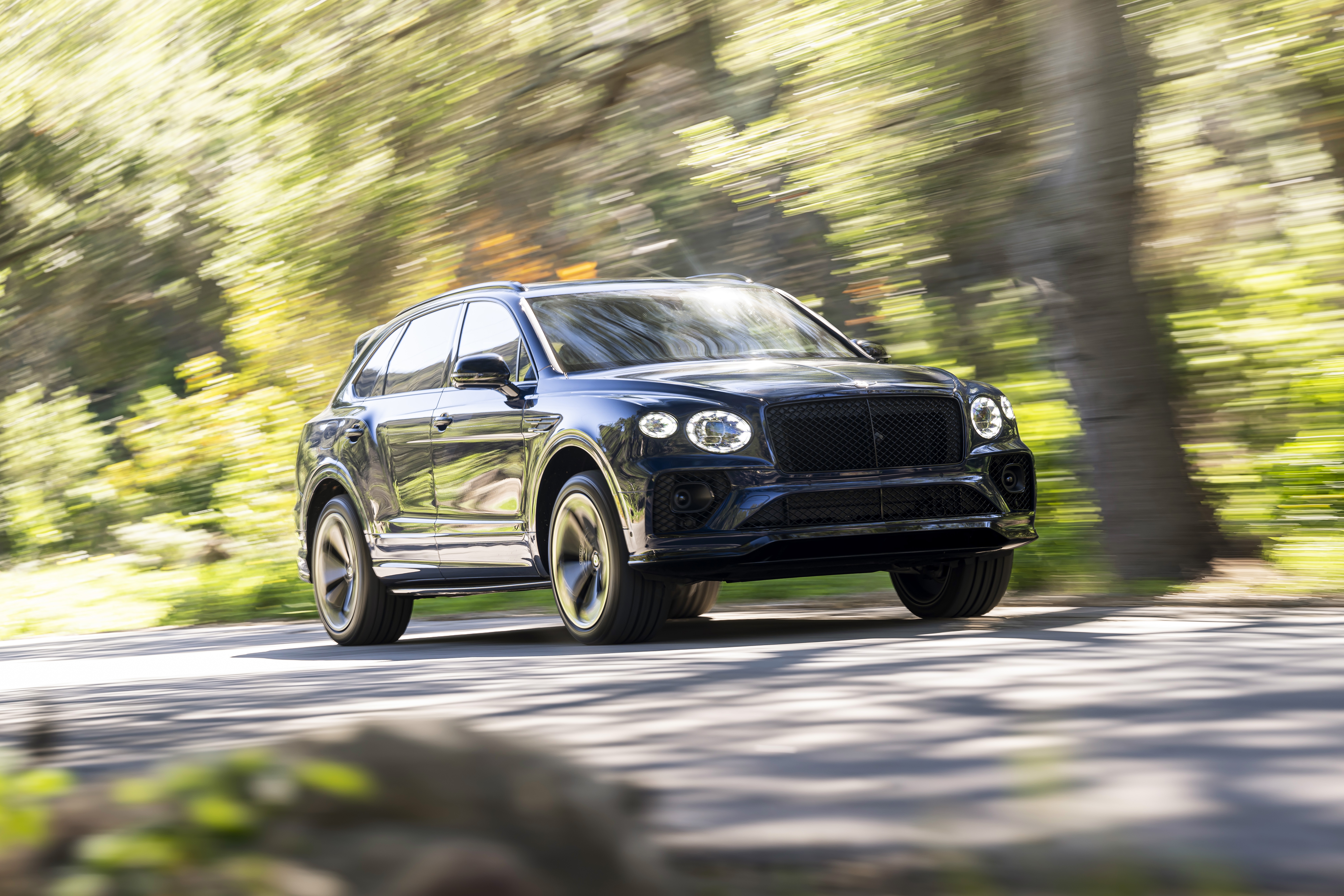 Black Bentley Bentayga S SUV driving on a road HD Wallpaper