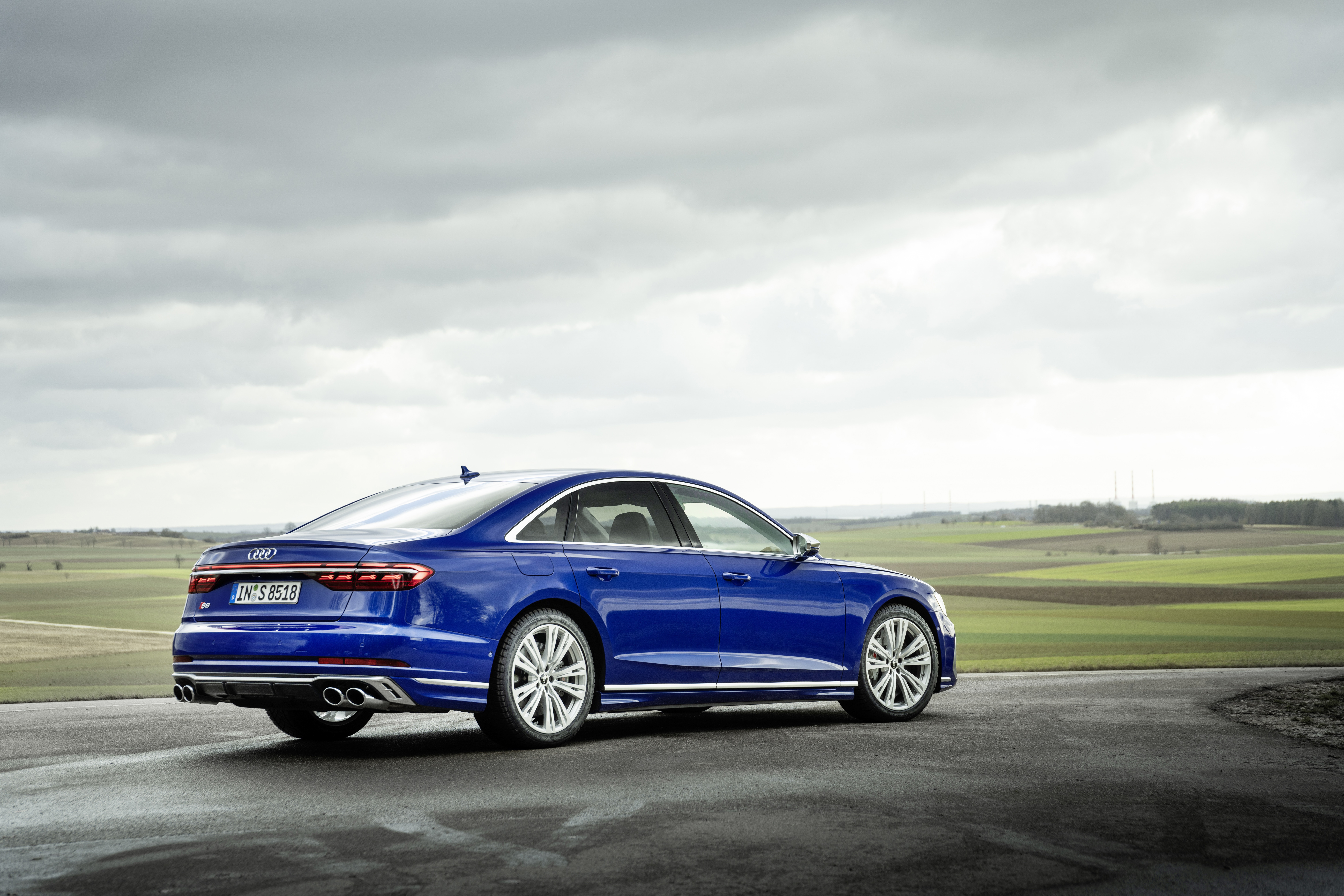 Blue Audi S8 sedan on a road HD Wallpaper