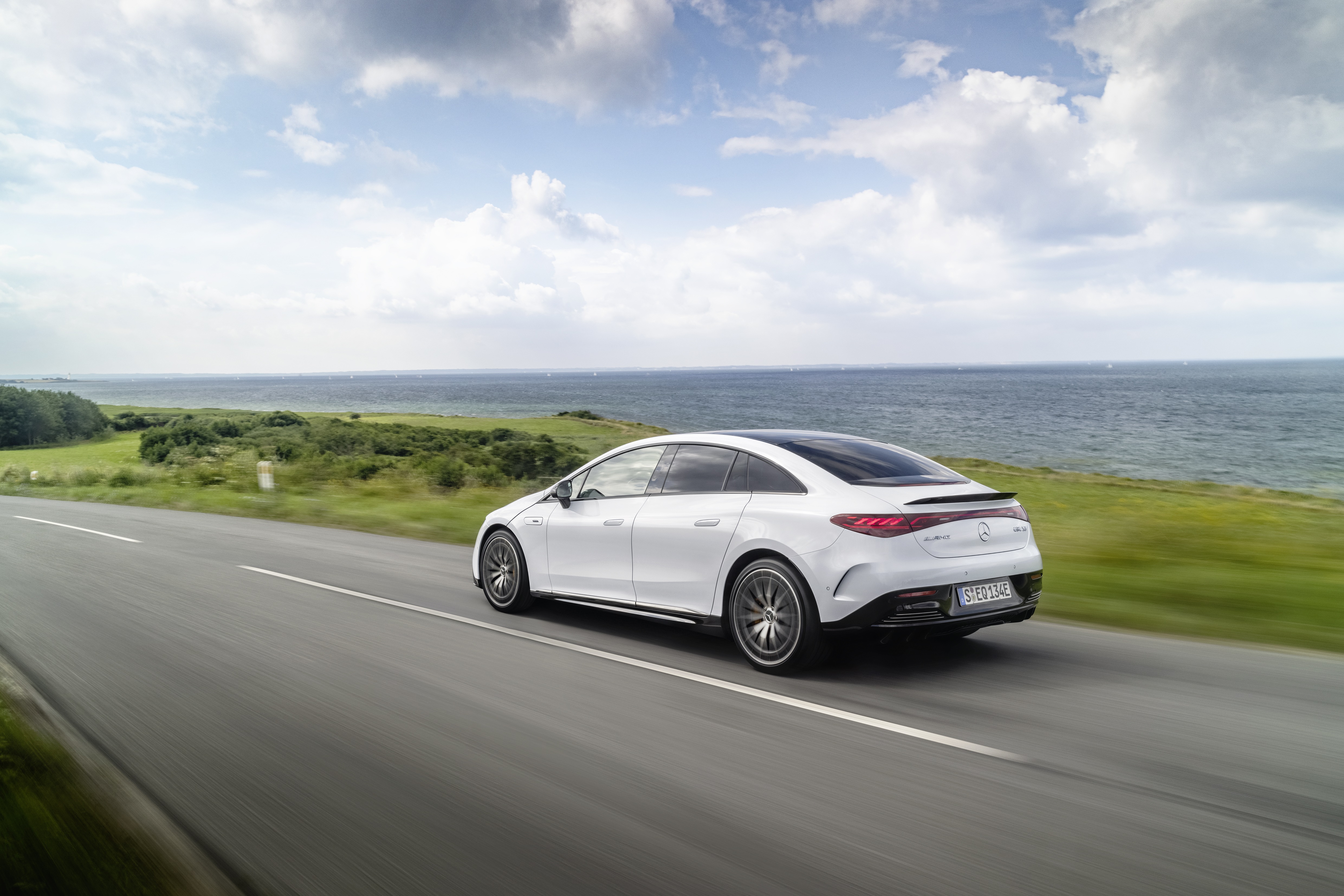 Mercedes-AMG EQE 43 4K driving on coastal road HD Wallpaper