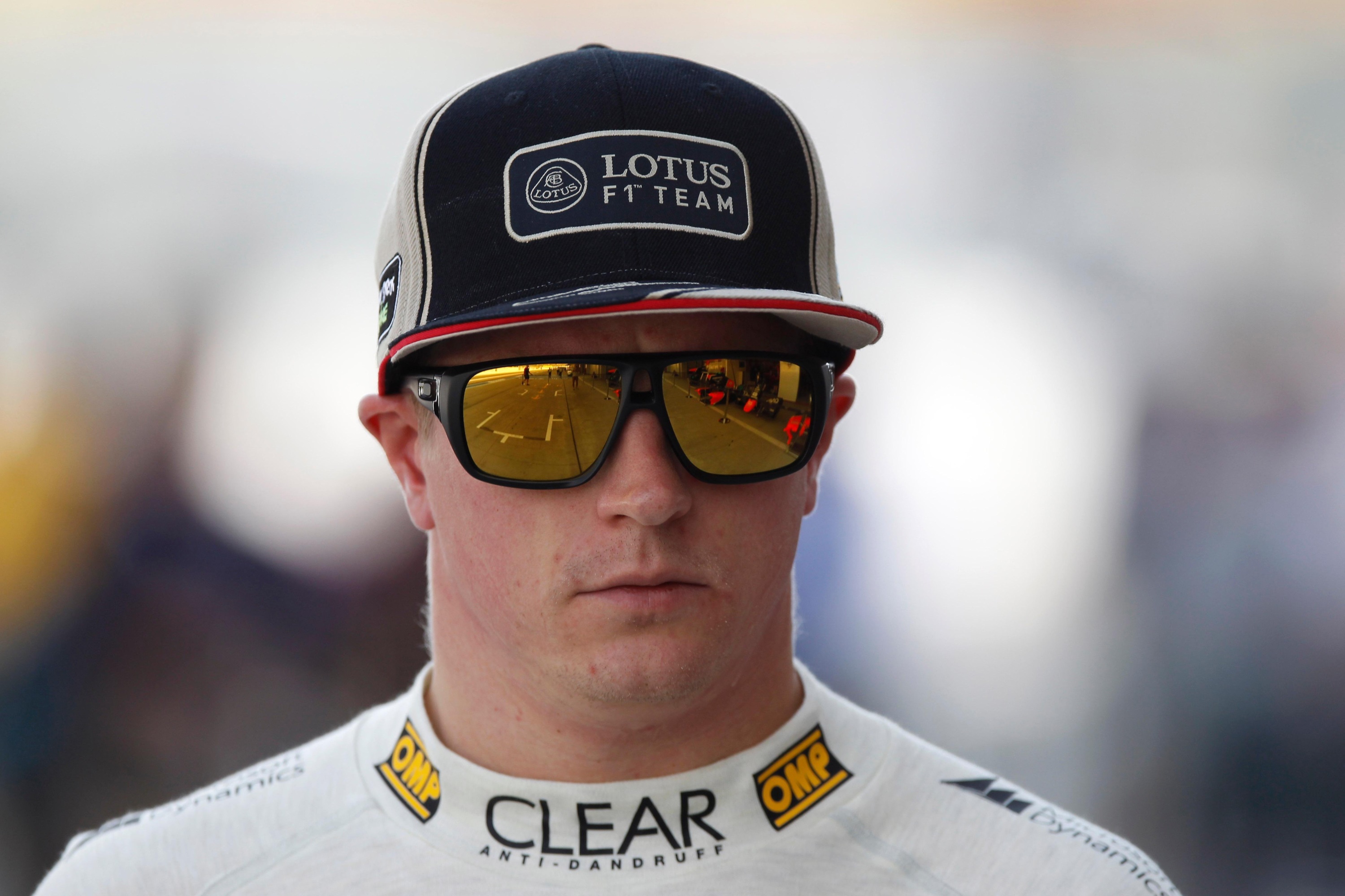 Kimi Räikkönen wearing Lotus F1 Team cap and sunglasses HD Wallpaper