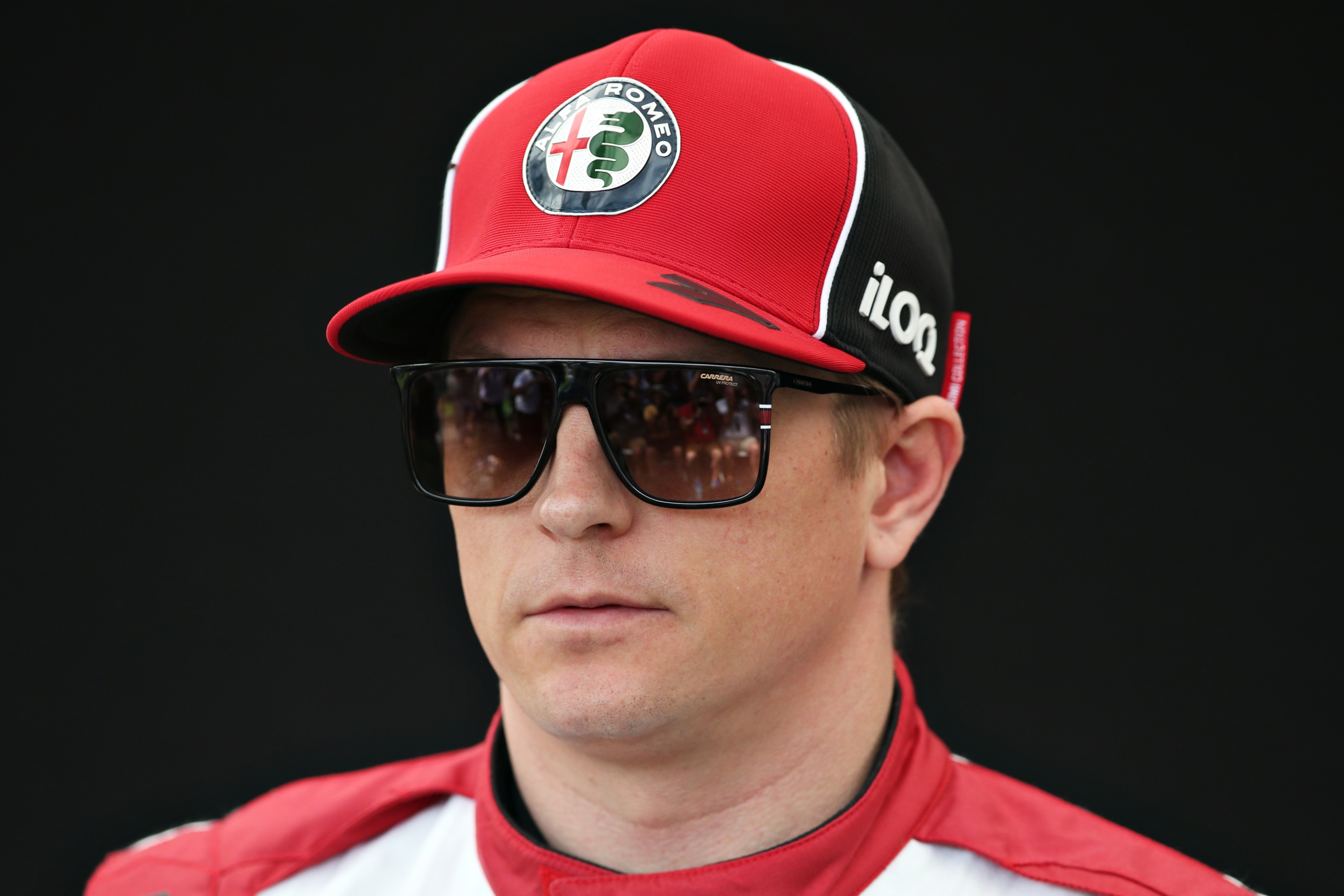 Kimi Räikkönen wearing Alfa Romeo cap and sunglasses HD Wallpaper