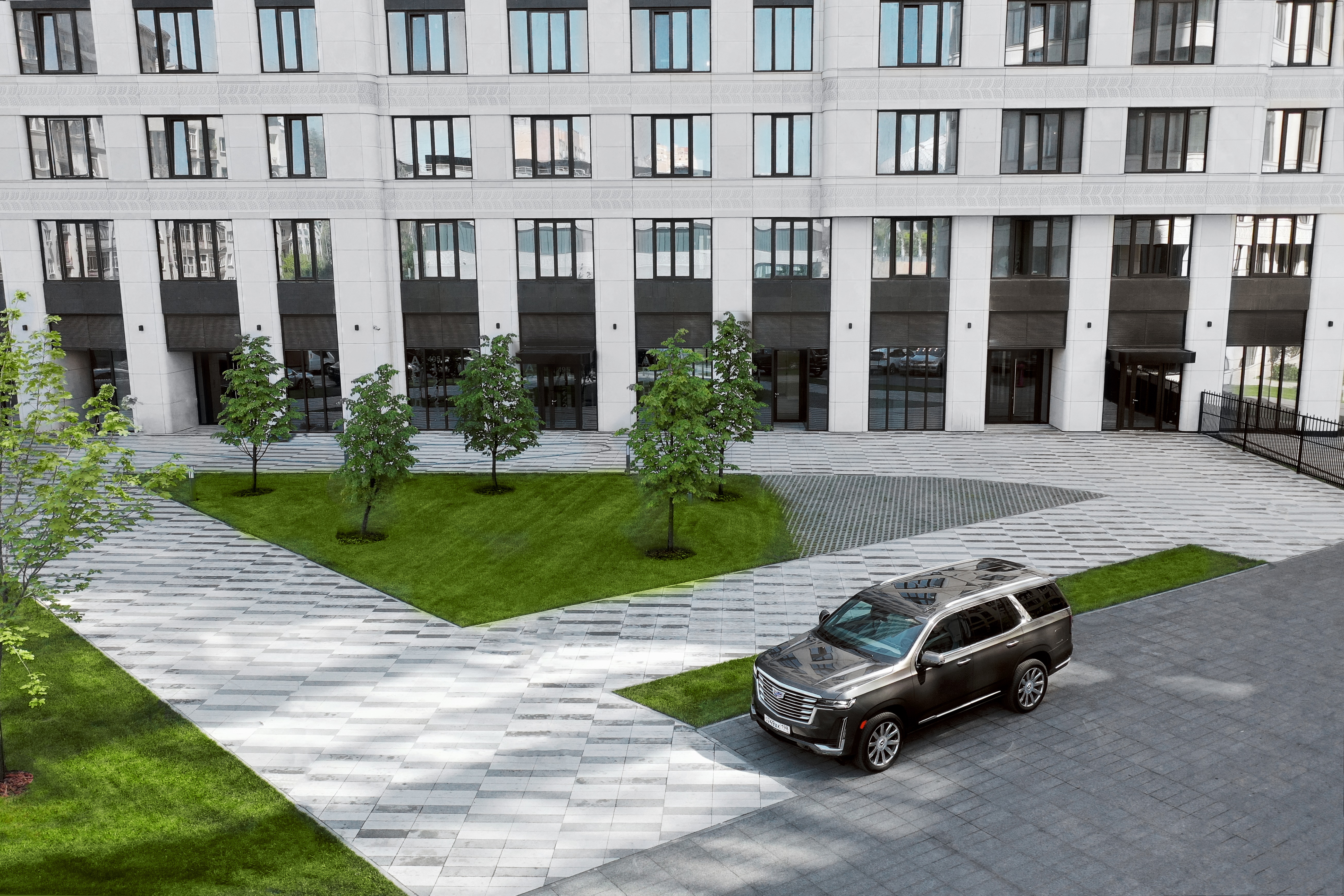 Cadillac Escalade 600 4K SUV parked in front of building HD Wallpaper