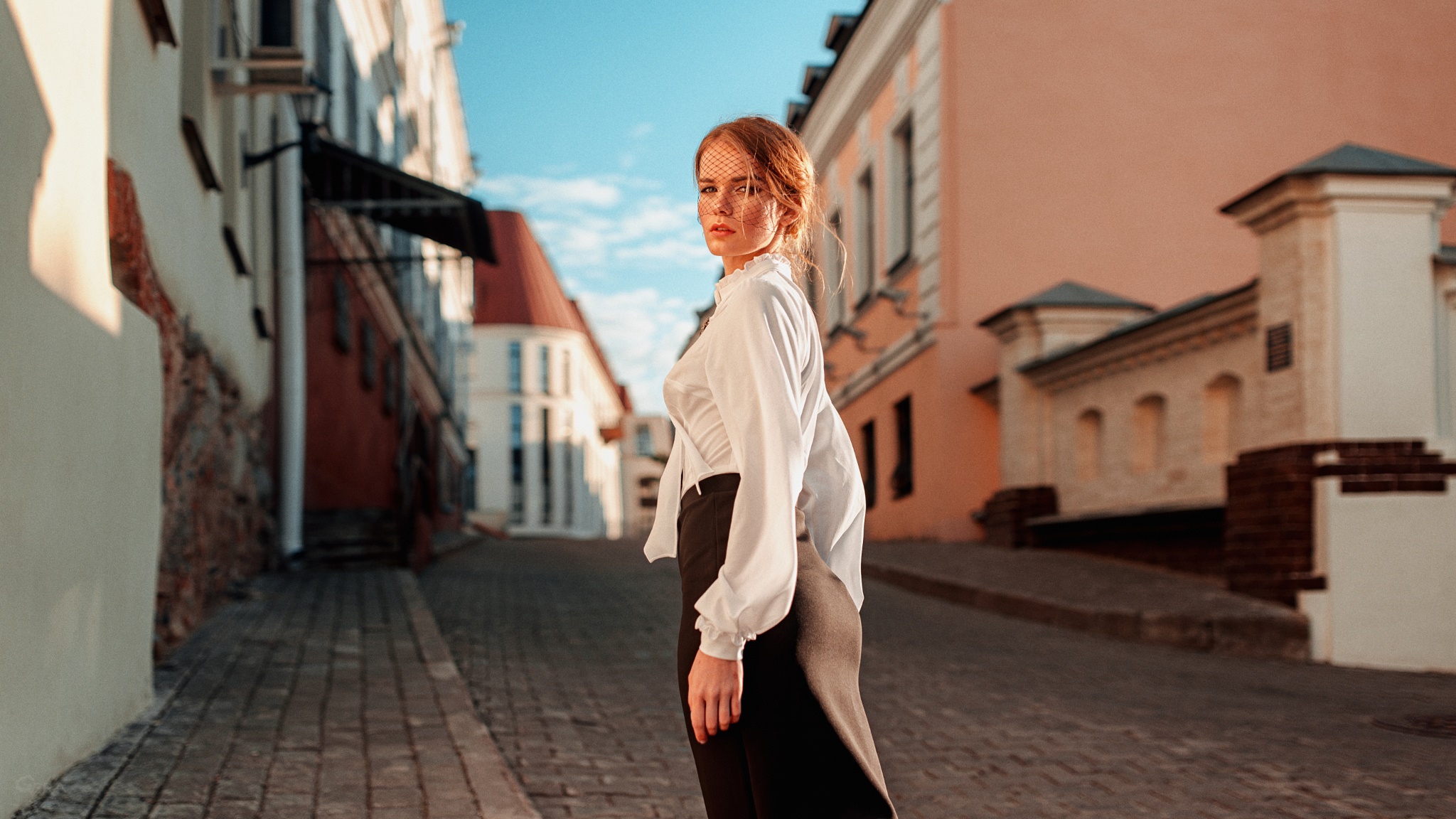 Woman in white blouse and veil on cobblestone street HD Wallpaper
