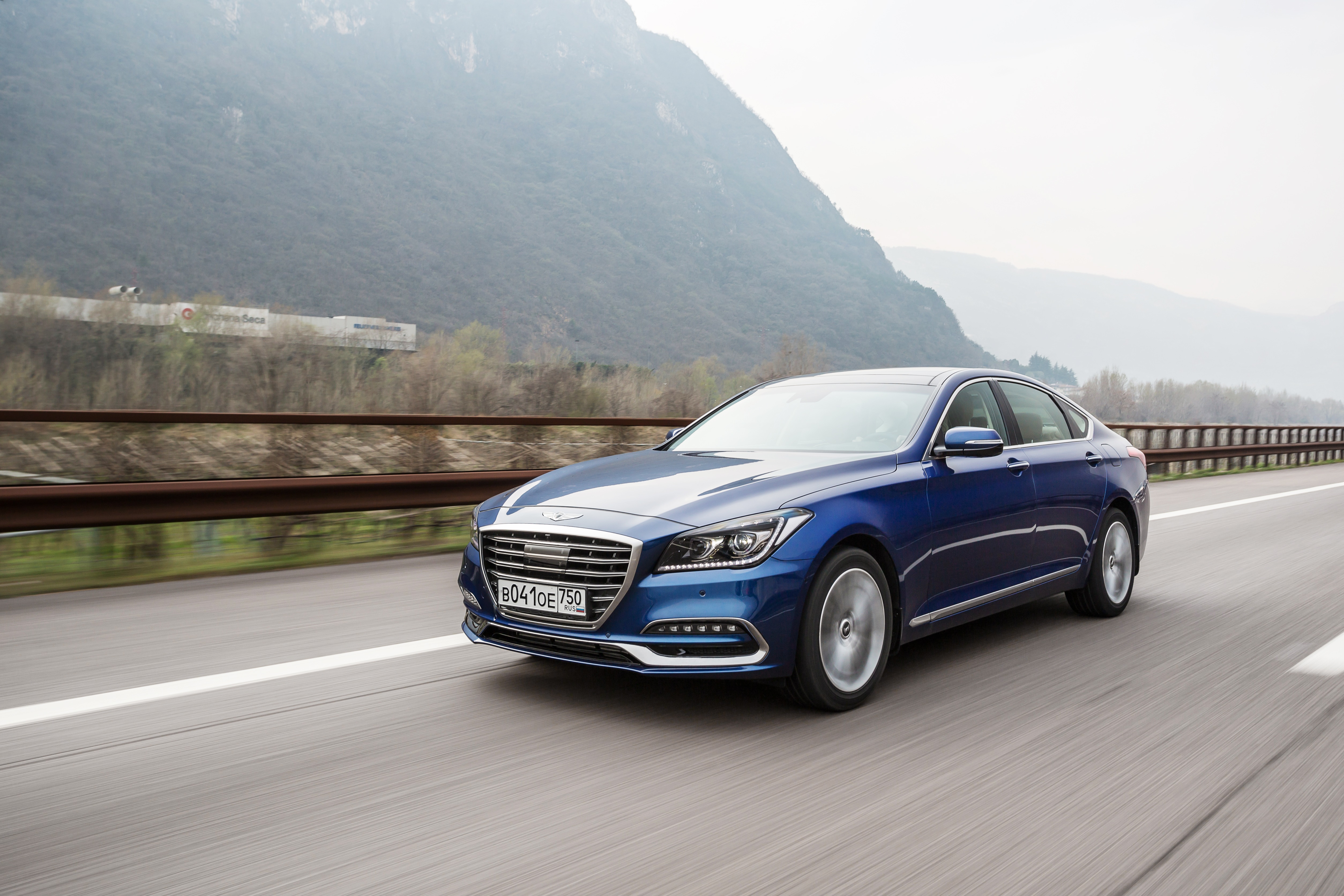 Blue Genesis G80 4K driving on a highway HD Wallpaper