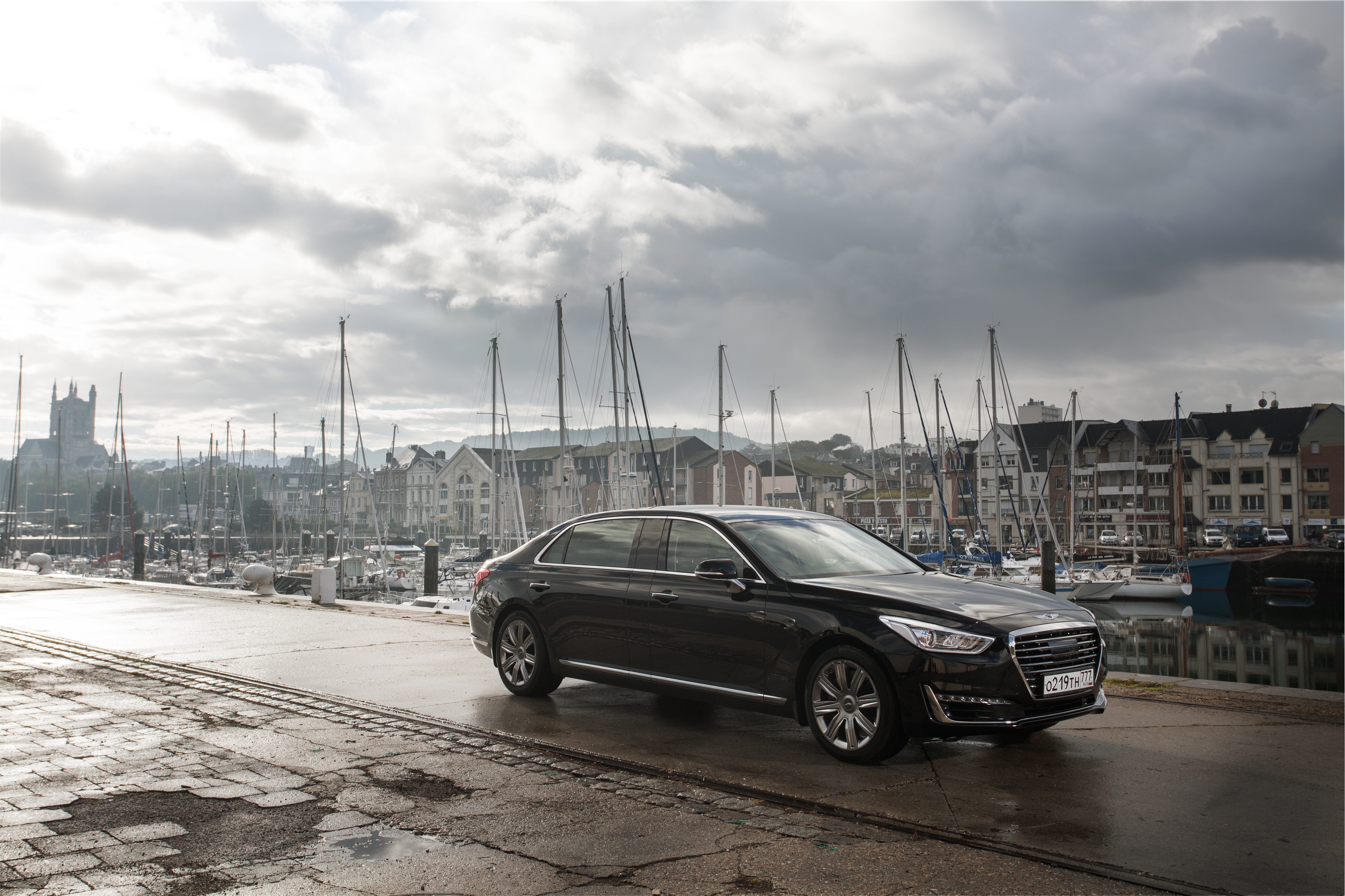 Genesis G90 sedan parked by a harbor HD Wallpaper