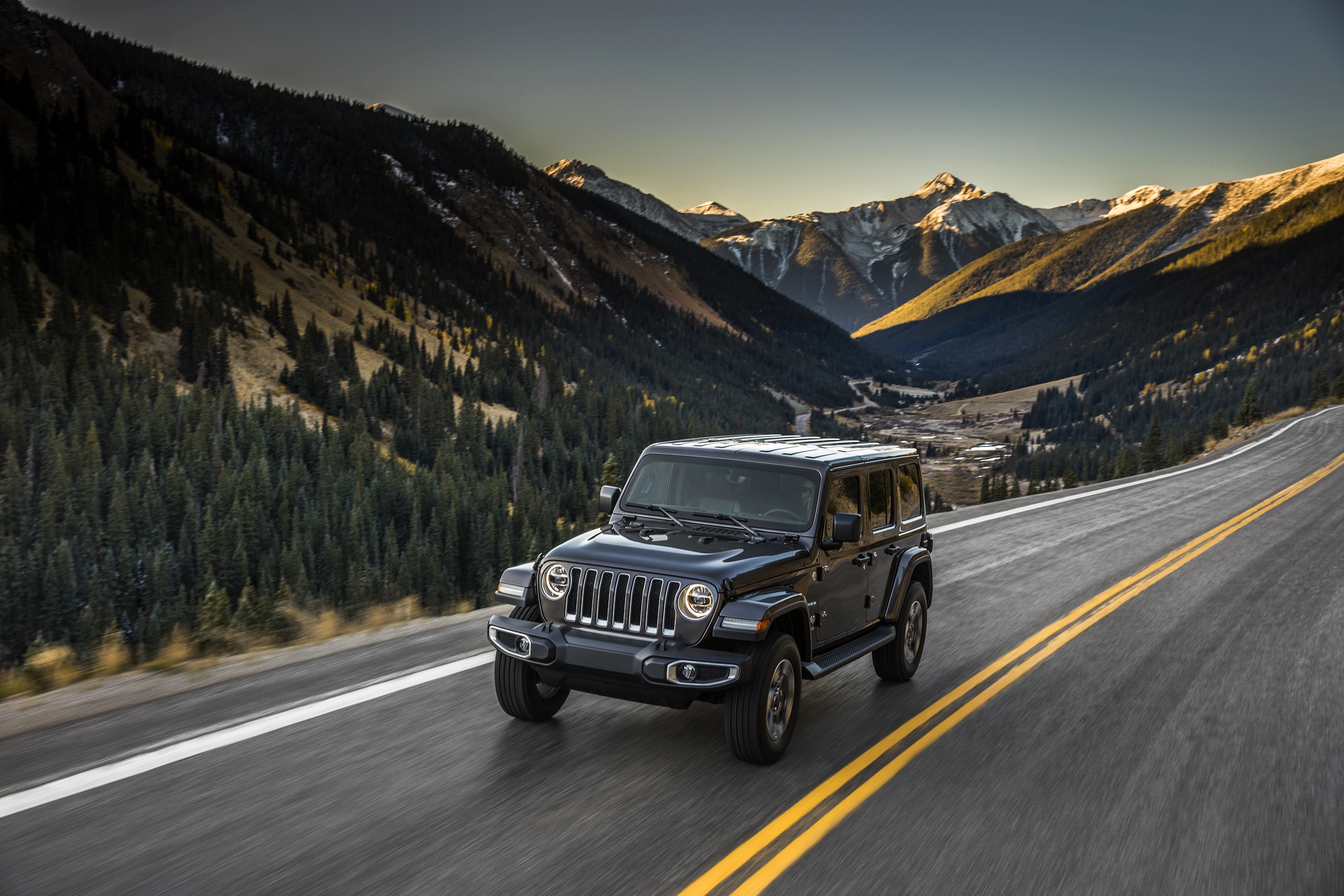 Black Jeep Wrangler driving on mountain road HD Wallpaper