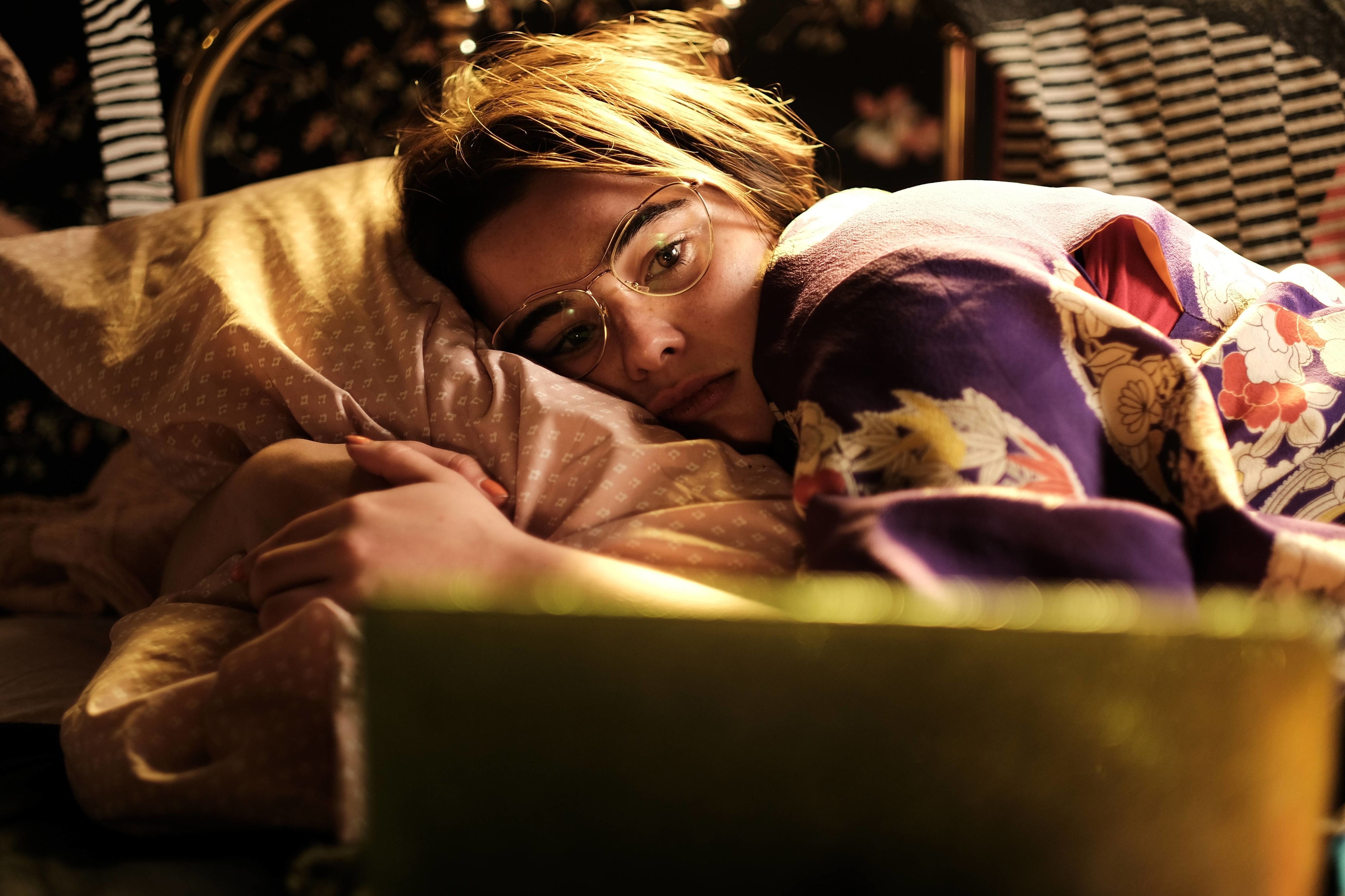 Woman in kimono lying on bed with glasses HD Wallpaper