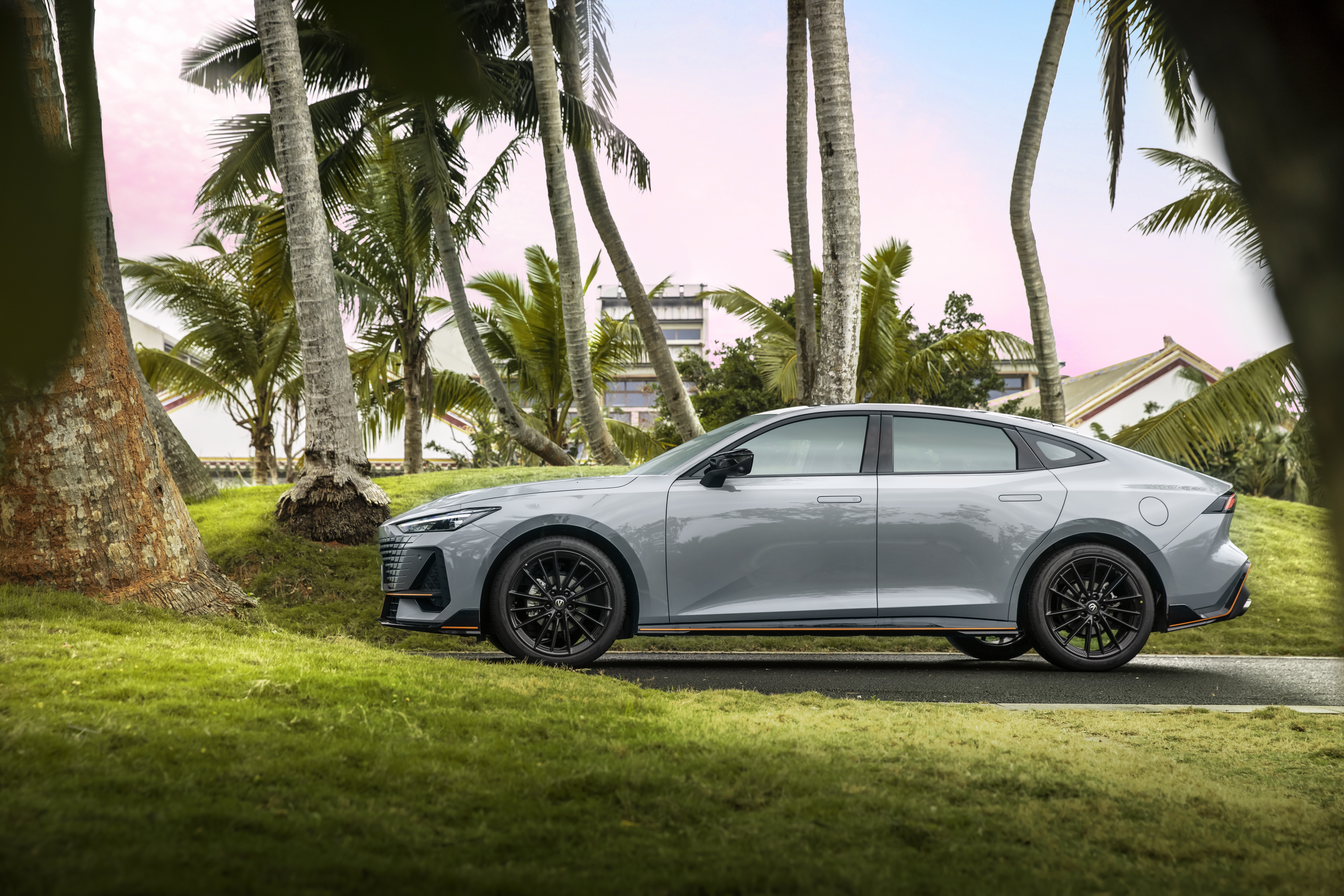 Changan UNI-V sedan parked near palm trees HD Wallpaper