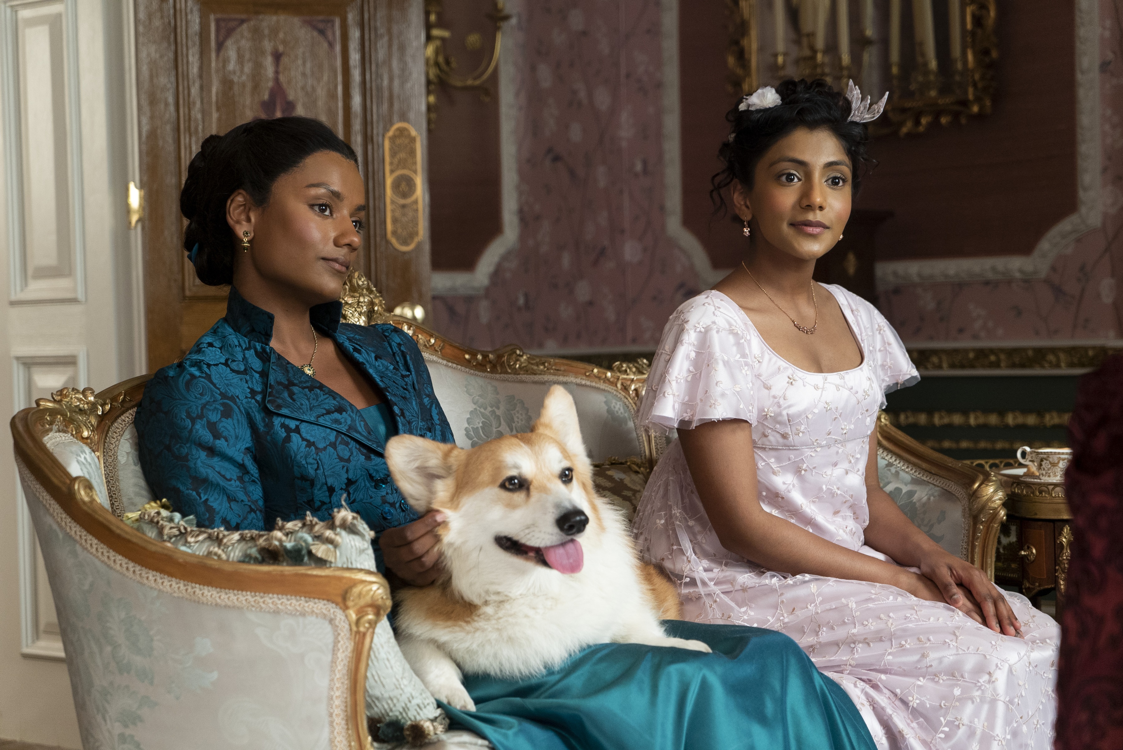 Two women and a corgi on a sofa in Bridgerton HD Wallpaper