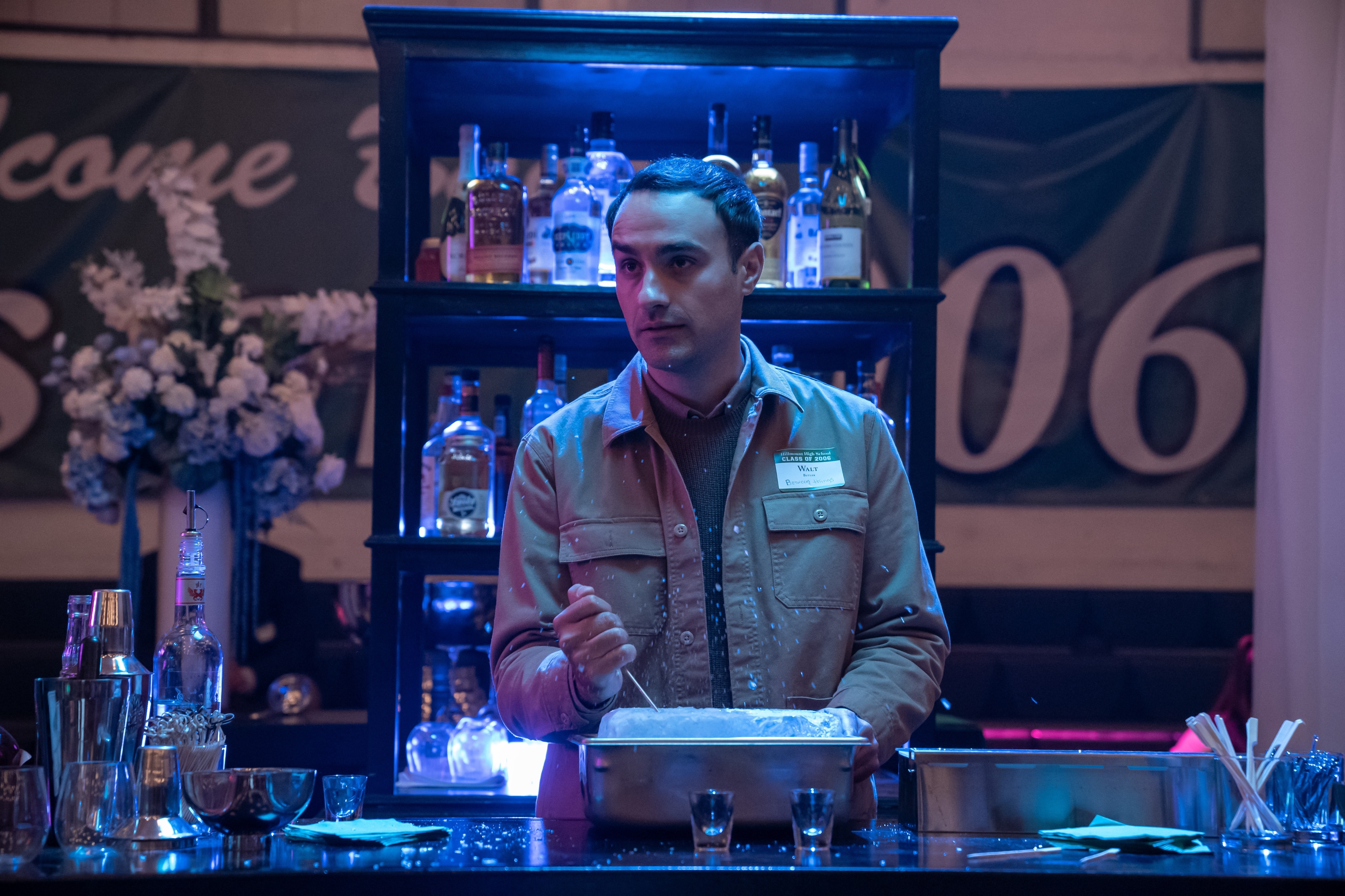 Man preparing drinks at a bar in The Afterparty 4K HD Wallpaper