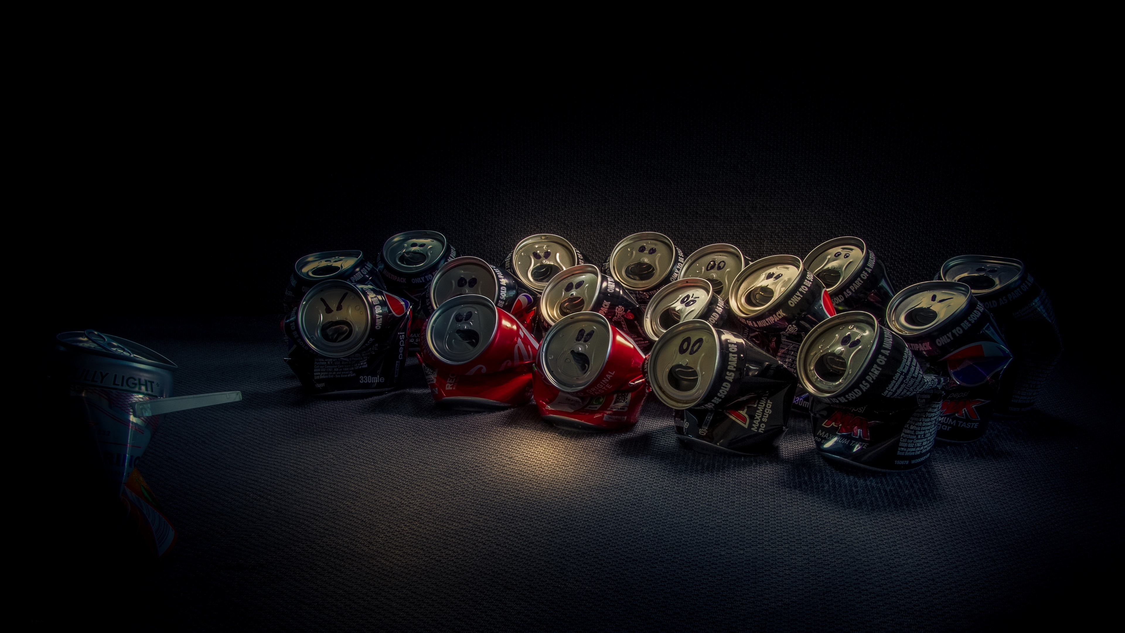 Crushed soda cans with drawn faces HD Wallpaper